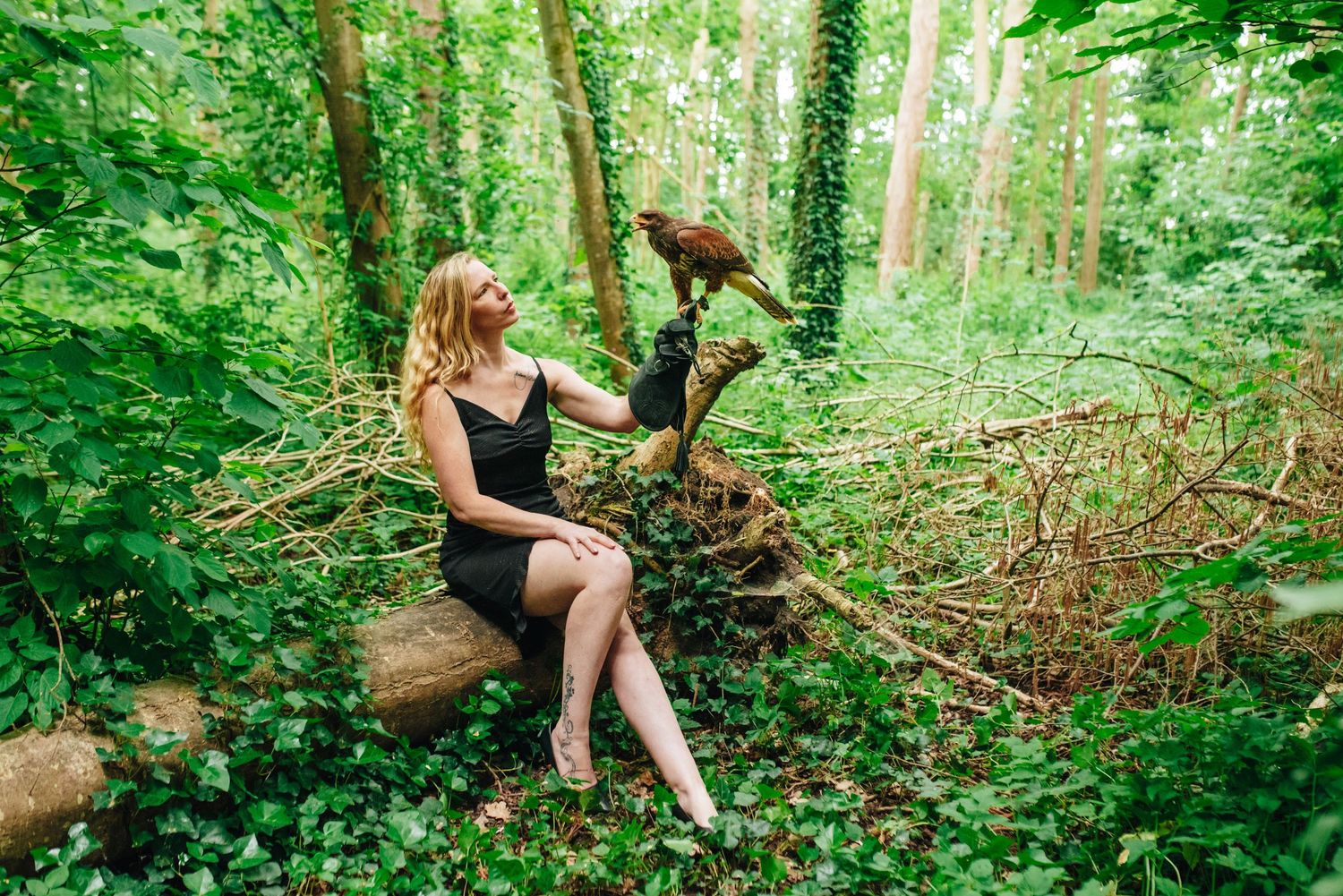 Nature photography session in verdant forest setting with artistic poses.
