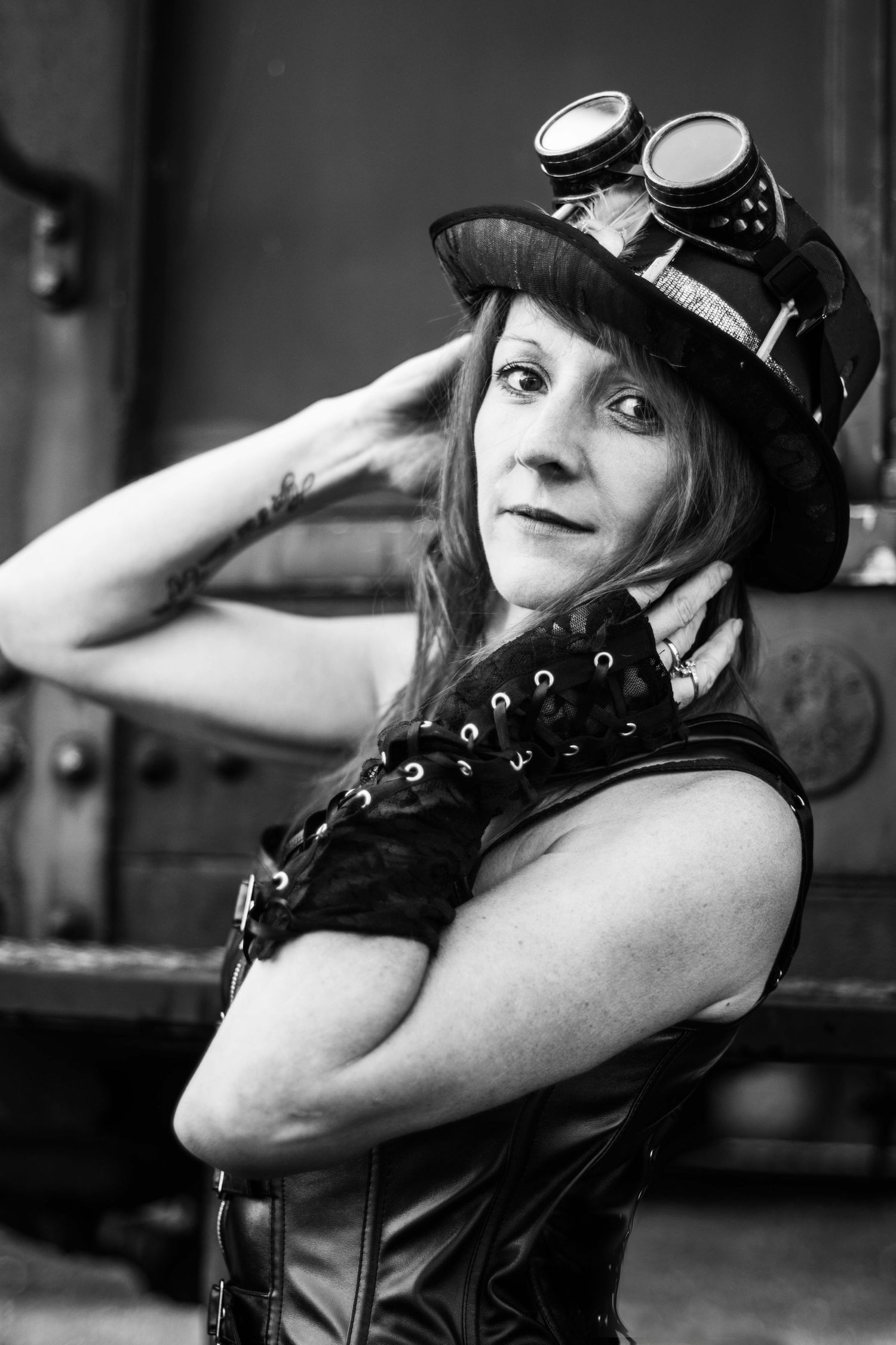 Black and white portrait series showing gothic steampunk fashion with leather and goggles.