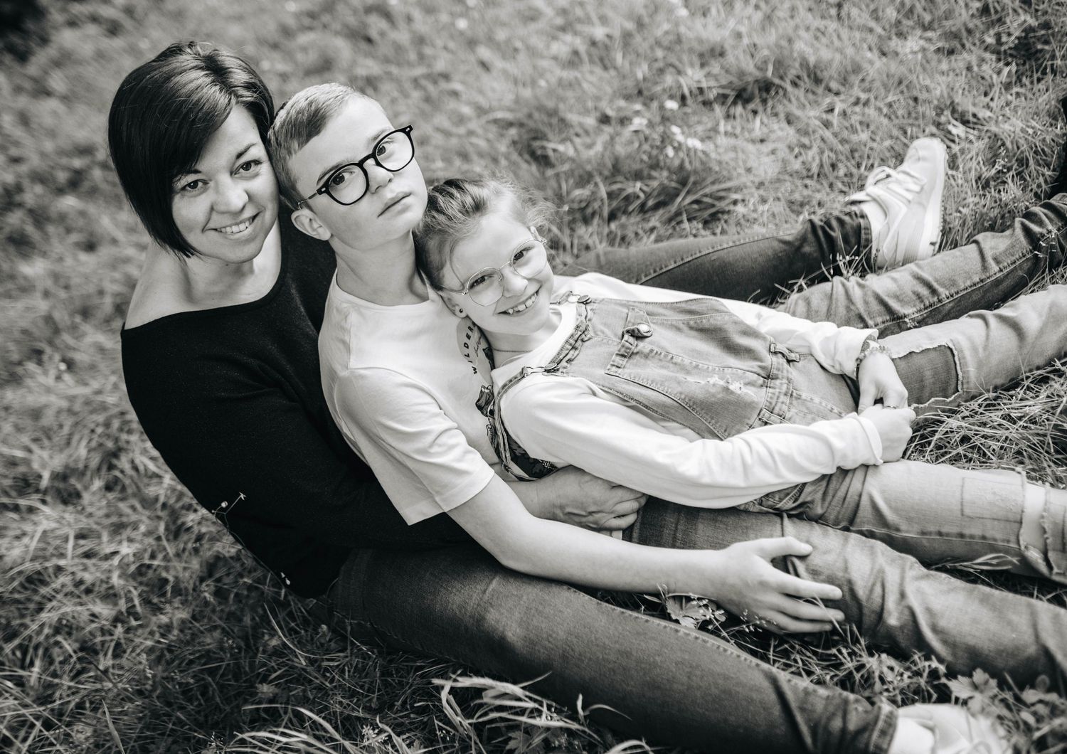 Black and white series of casual family photos taken while relaxing outdoors.