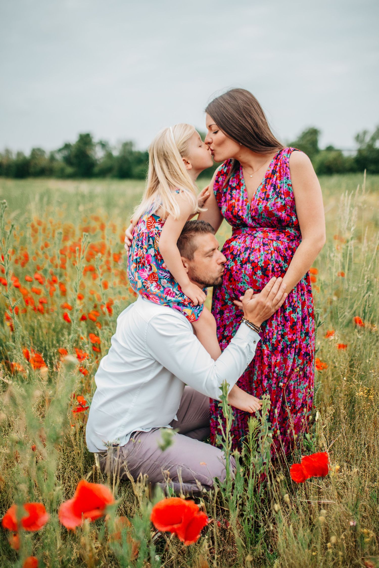 Beautiful red poppies bloom in a summer meadow during an intimate outdoor photoshoot.
