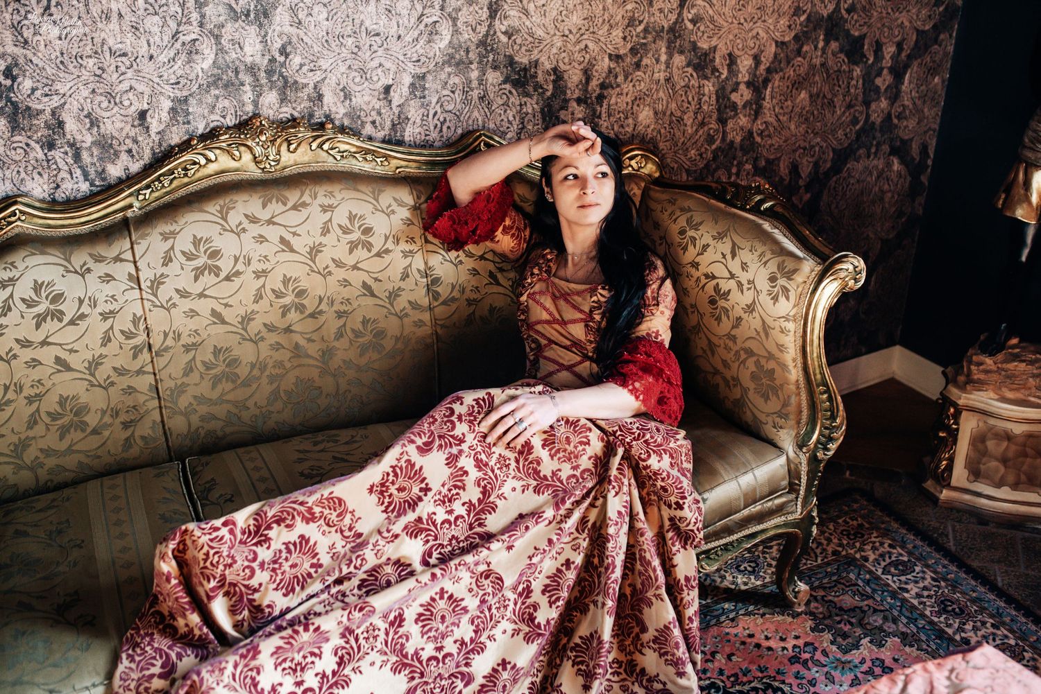 Atmospheric vintage photoshoot featuring period dresses and antique furniture.