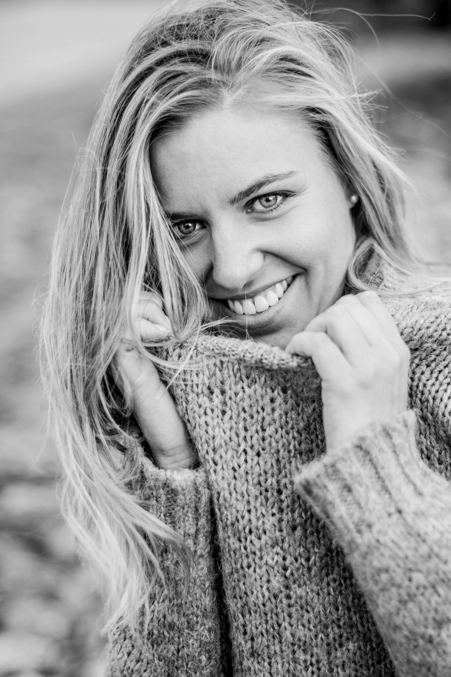 Close-up portrait with cozy knit sweater in black and white.