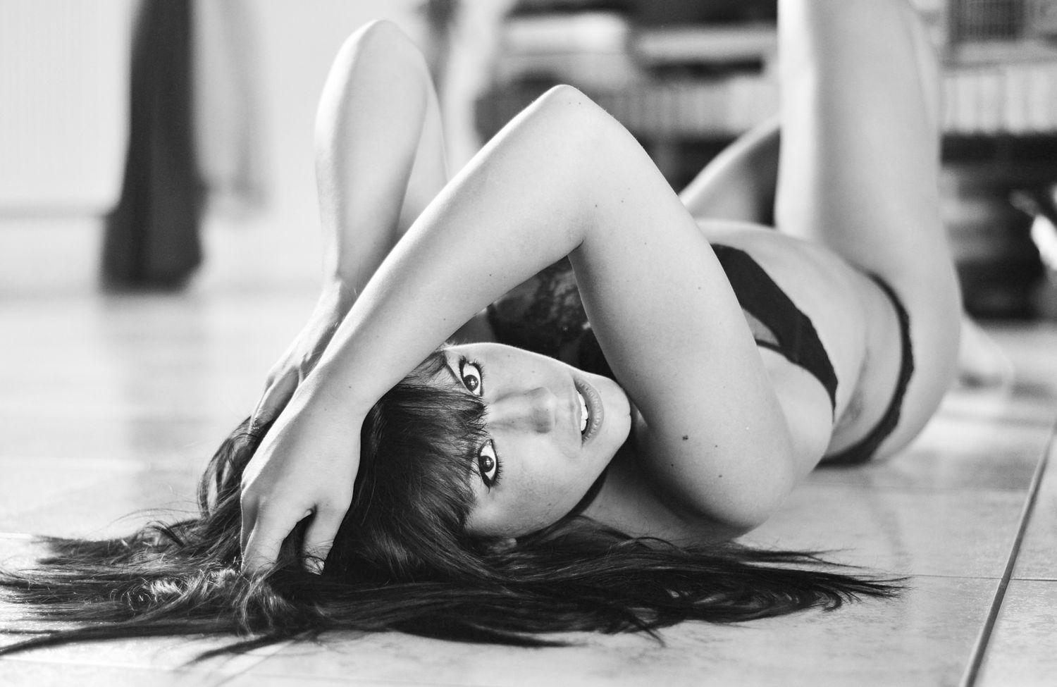 Artistic black and white boudoir photos on light background.