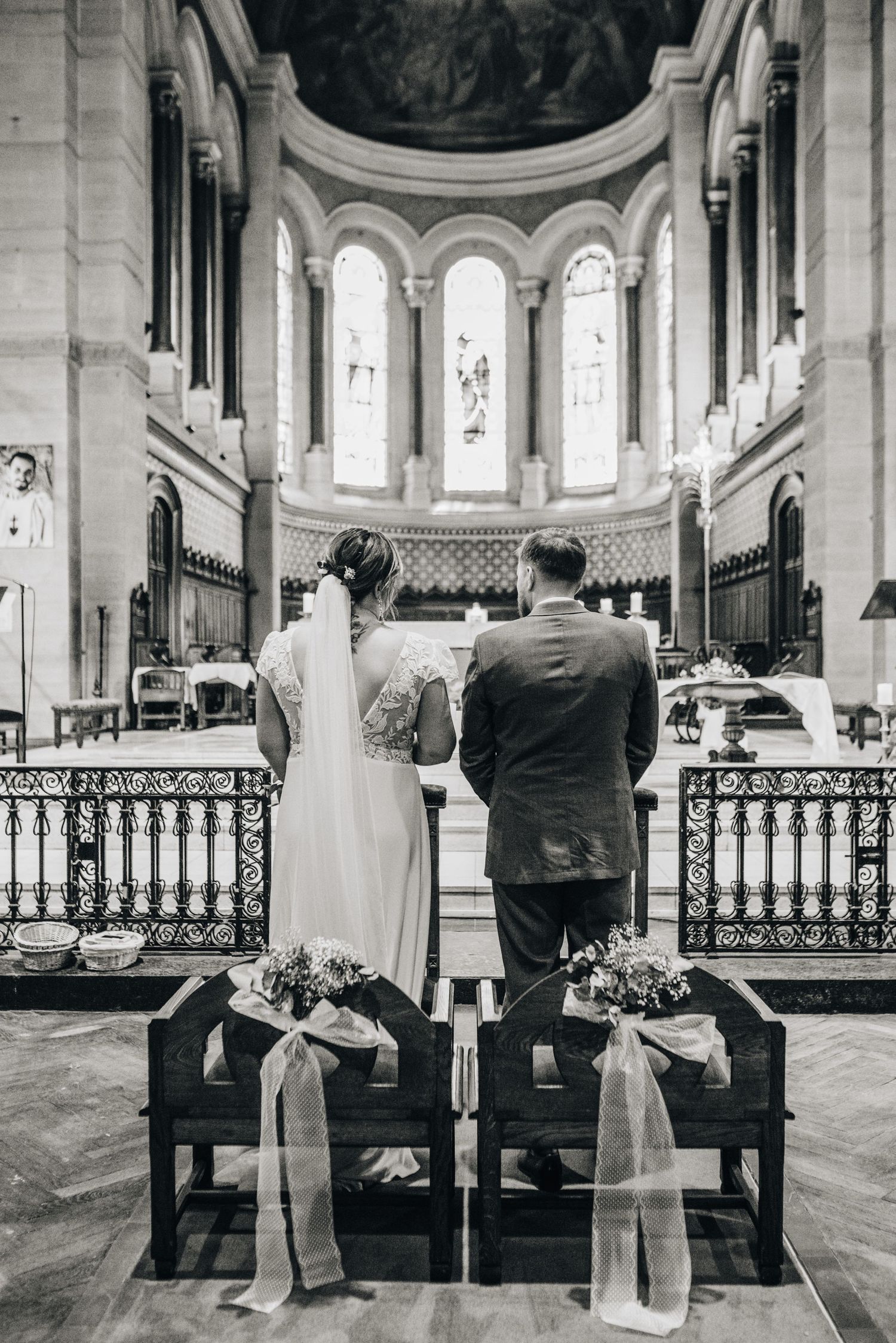 Church interior with ornate architecture and guests seated for ceremony.