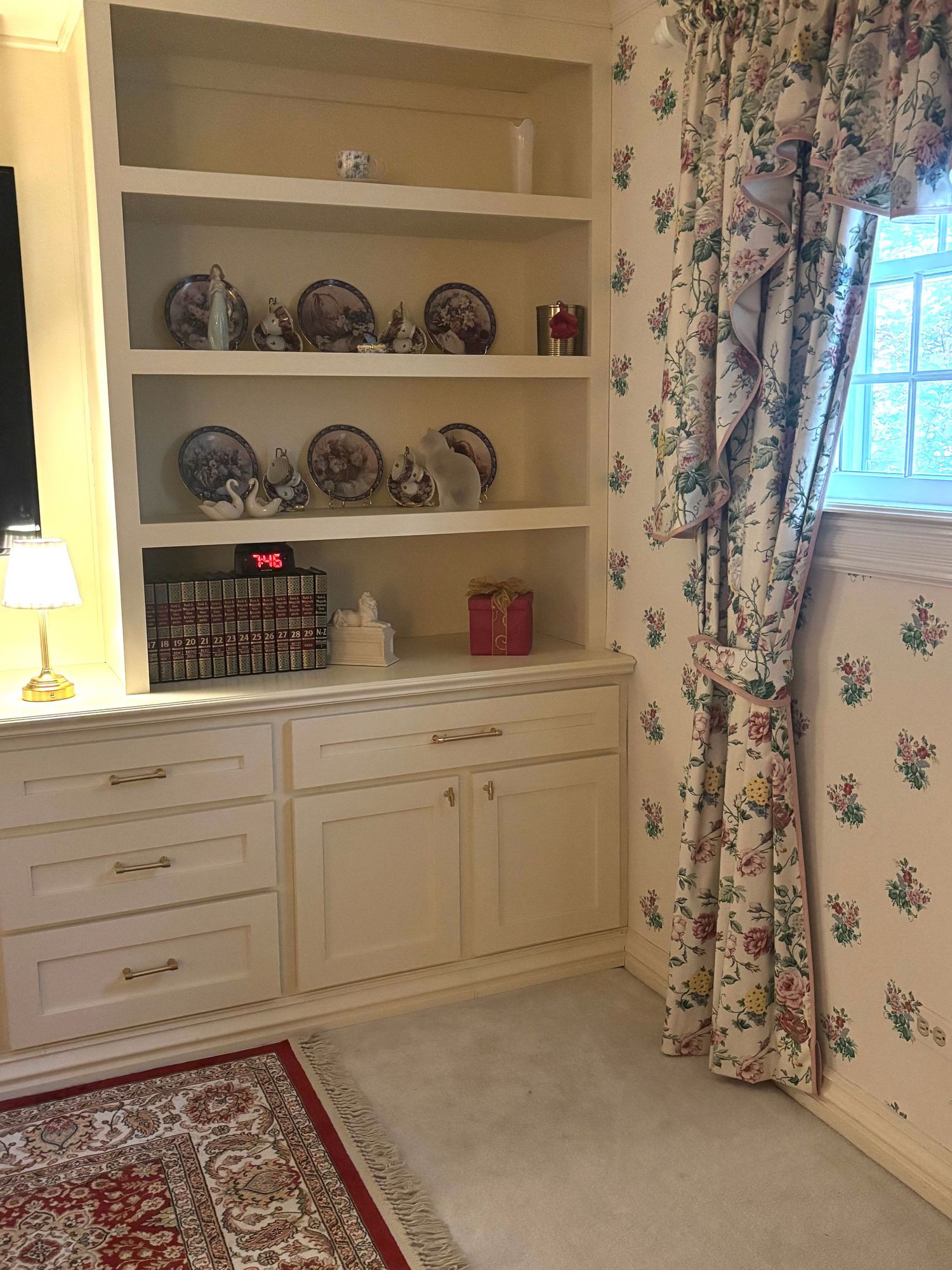 Custom designed and built bookshelves and storage in primary bedroom.