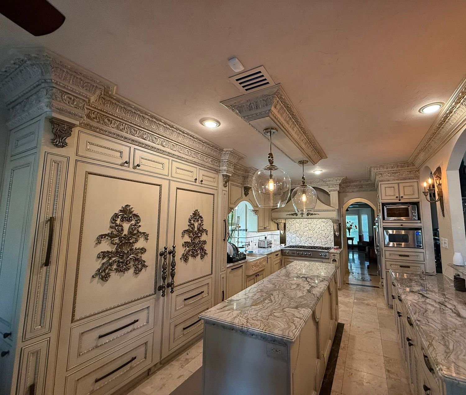 . Cabinetry is custom-made, crafted from solid wood, lacquered finish, with soft-close mechanisms, hidden storage and appliance integration.