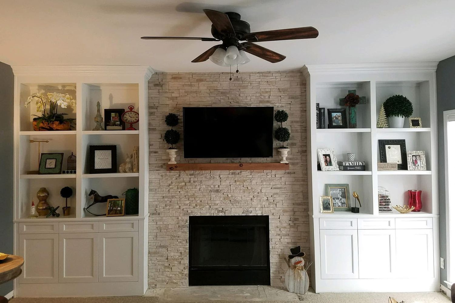 Custom built fireplace wall cabinetry