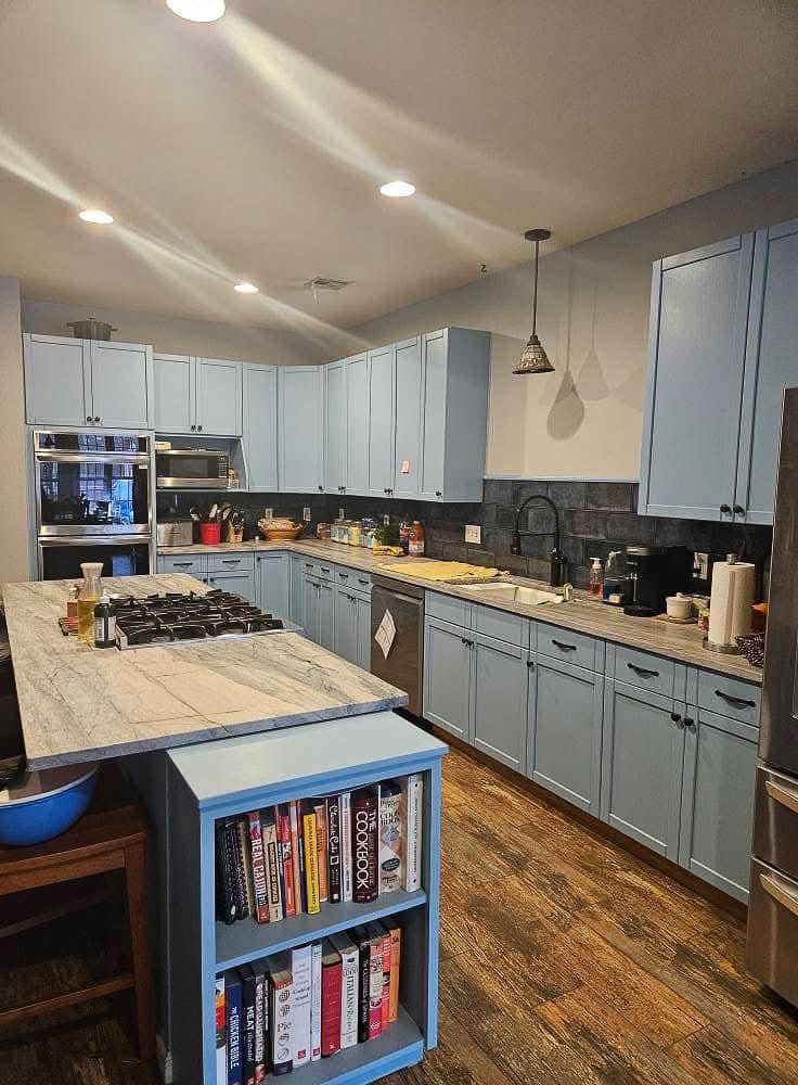 Kitchen cabinets updated with paint and additional storage
