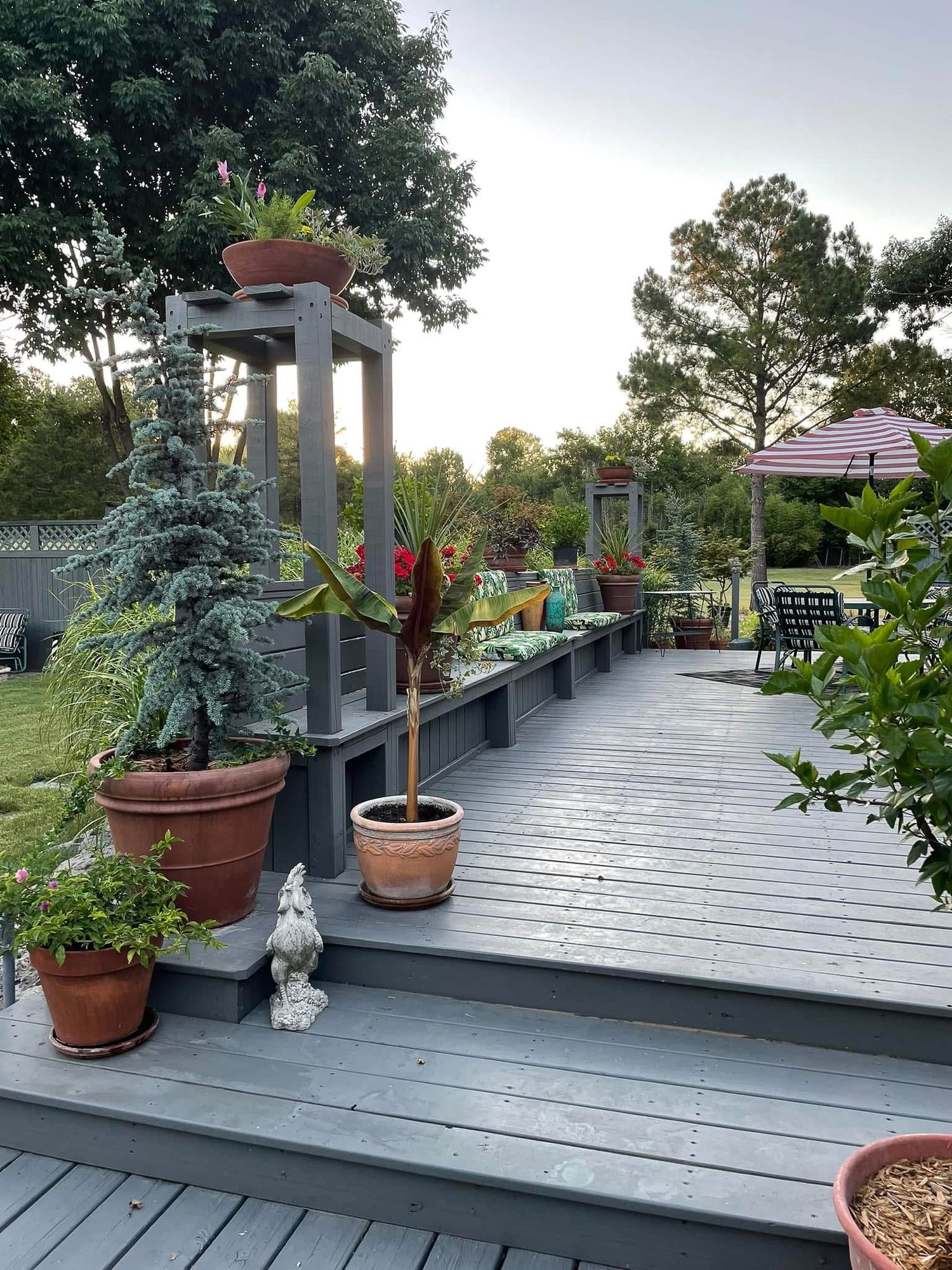 Deck space with built in seating and plant display.