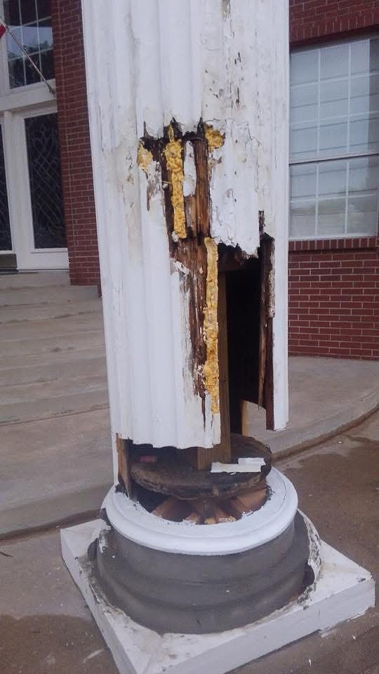 Damaged antique column before restoration.
