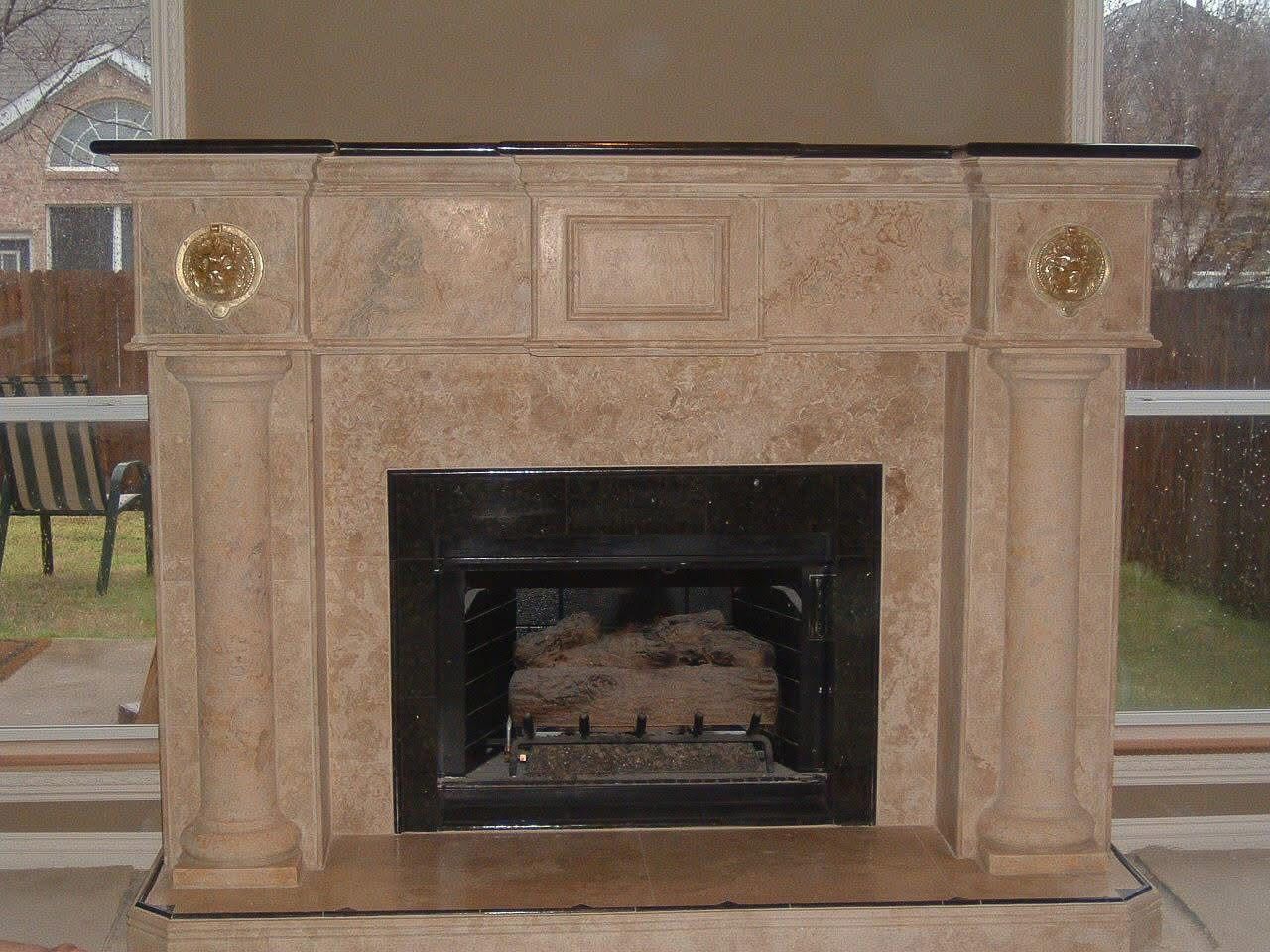 Stone fireplace mantle and hearth facade