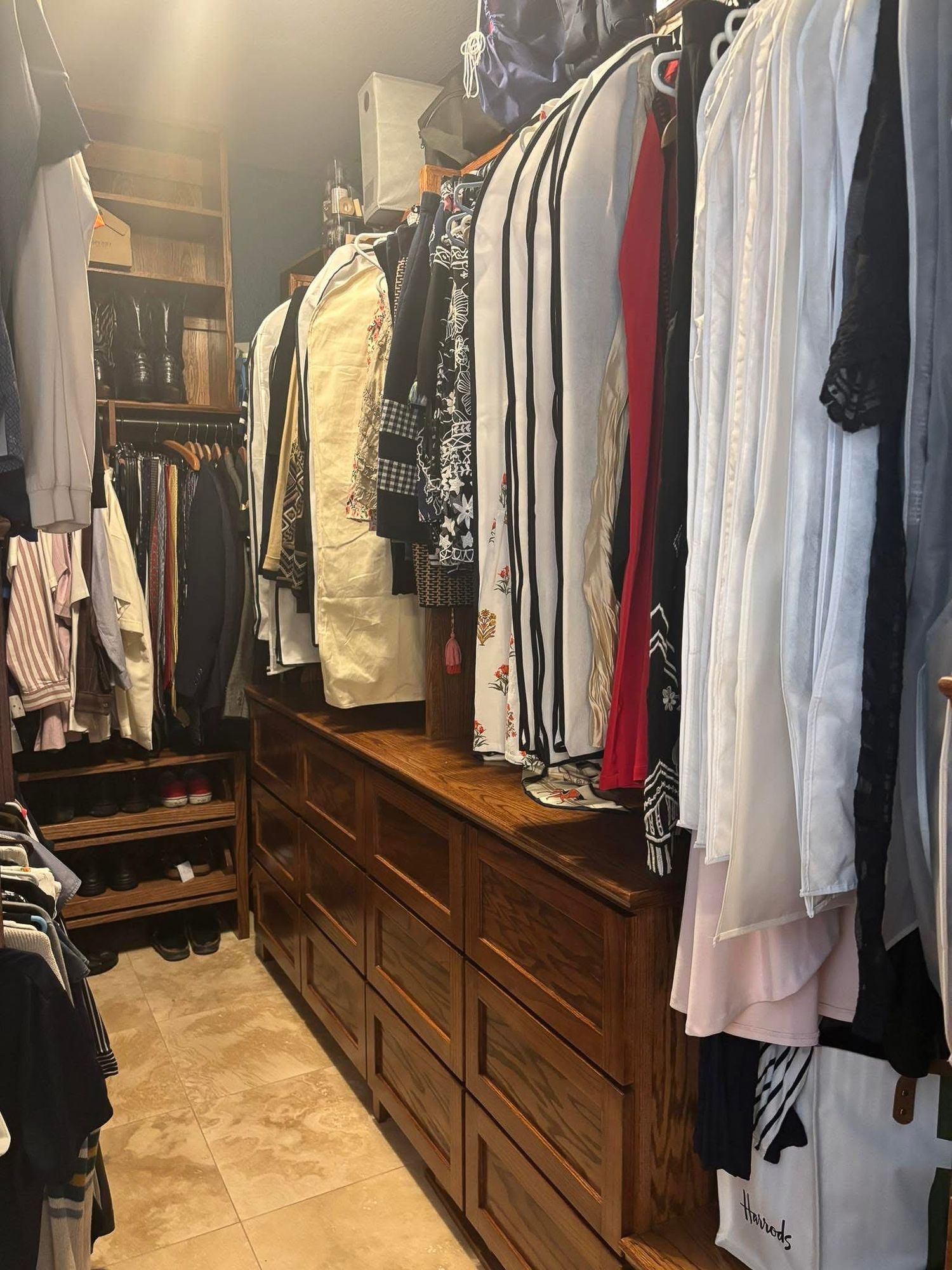 Custom closet with hanging and built in drawers.