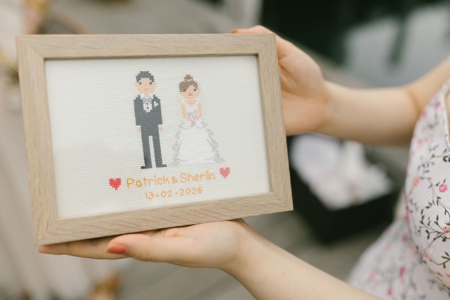 Framed pixel art wedding gift featuring bride and groom with names Patrick and Sherie and wedding date.