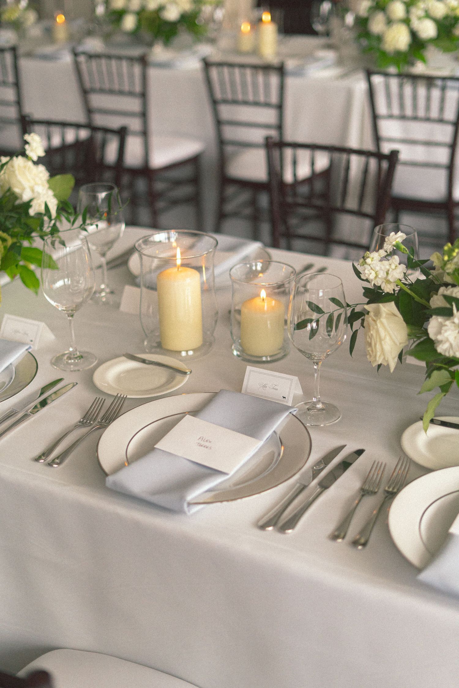 detail shot of wedding dinnerware and florals