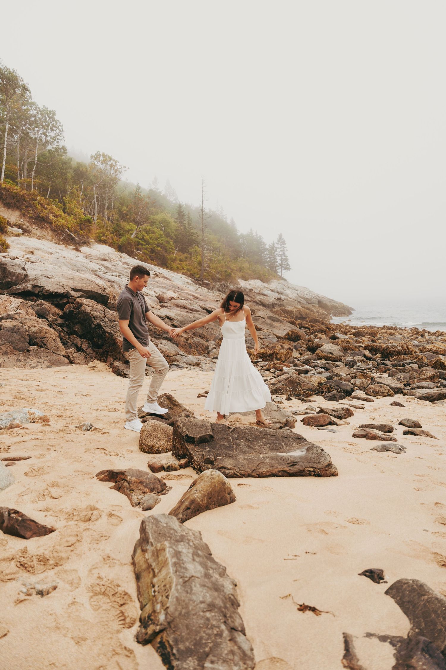 couple holding hands walking
