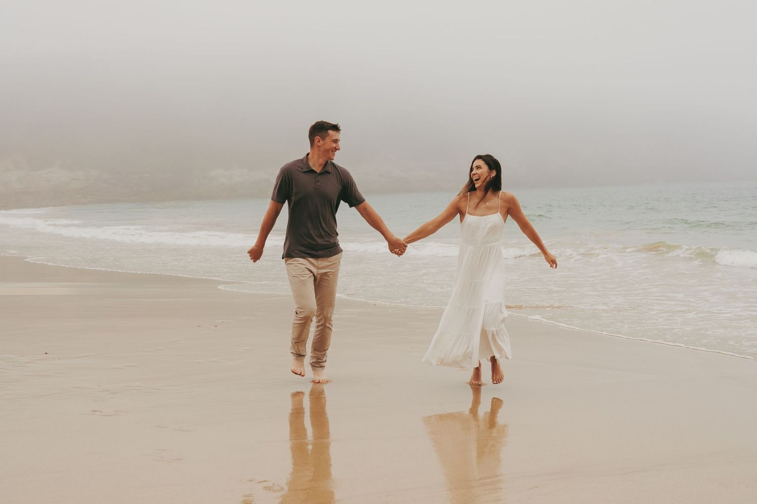 couple holding hands walking