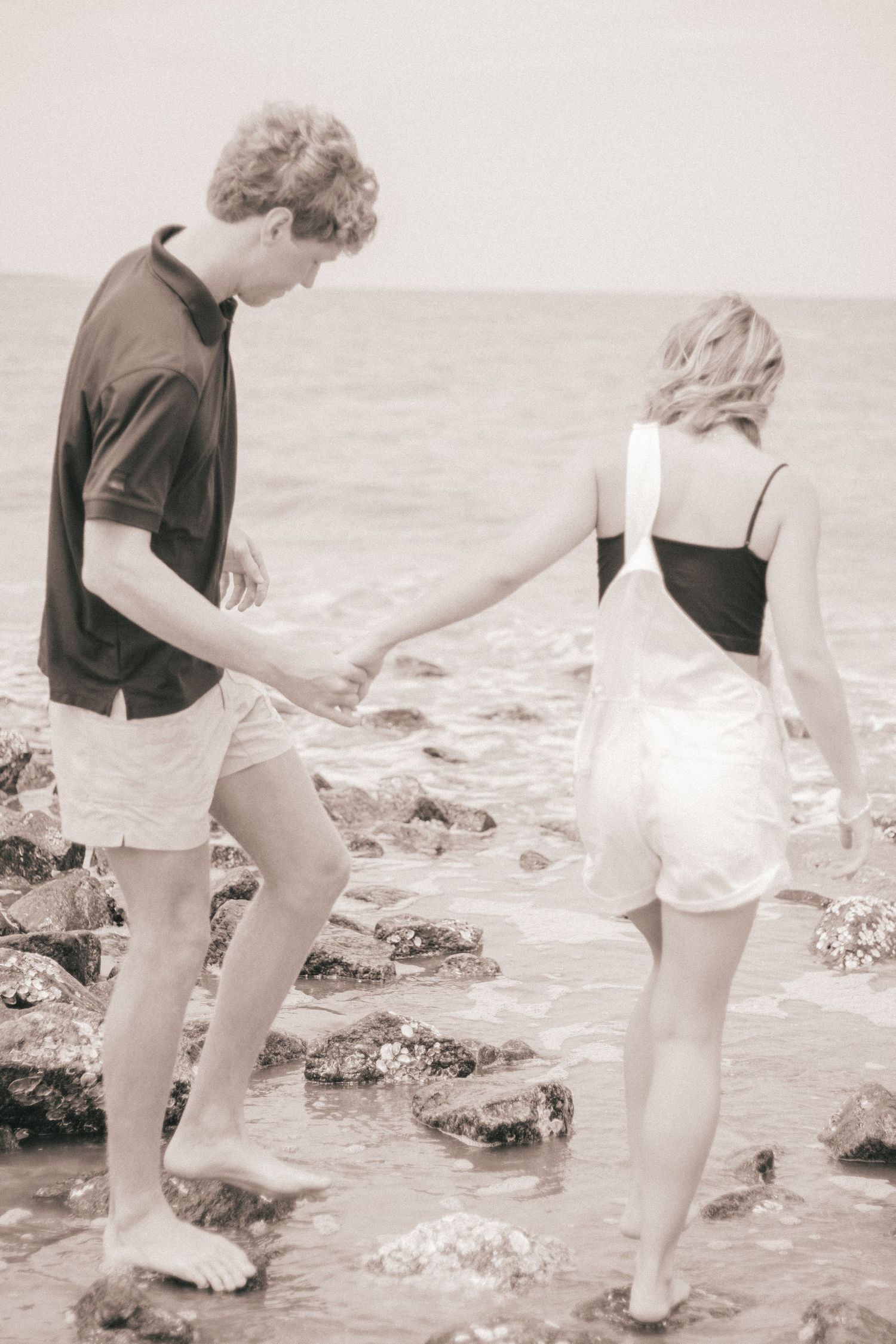 couple holding hands and walking.