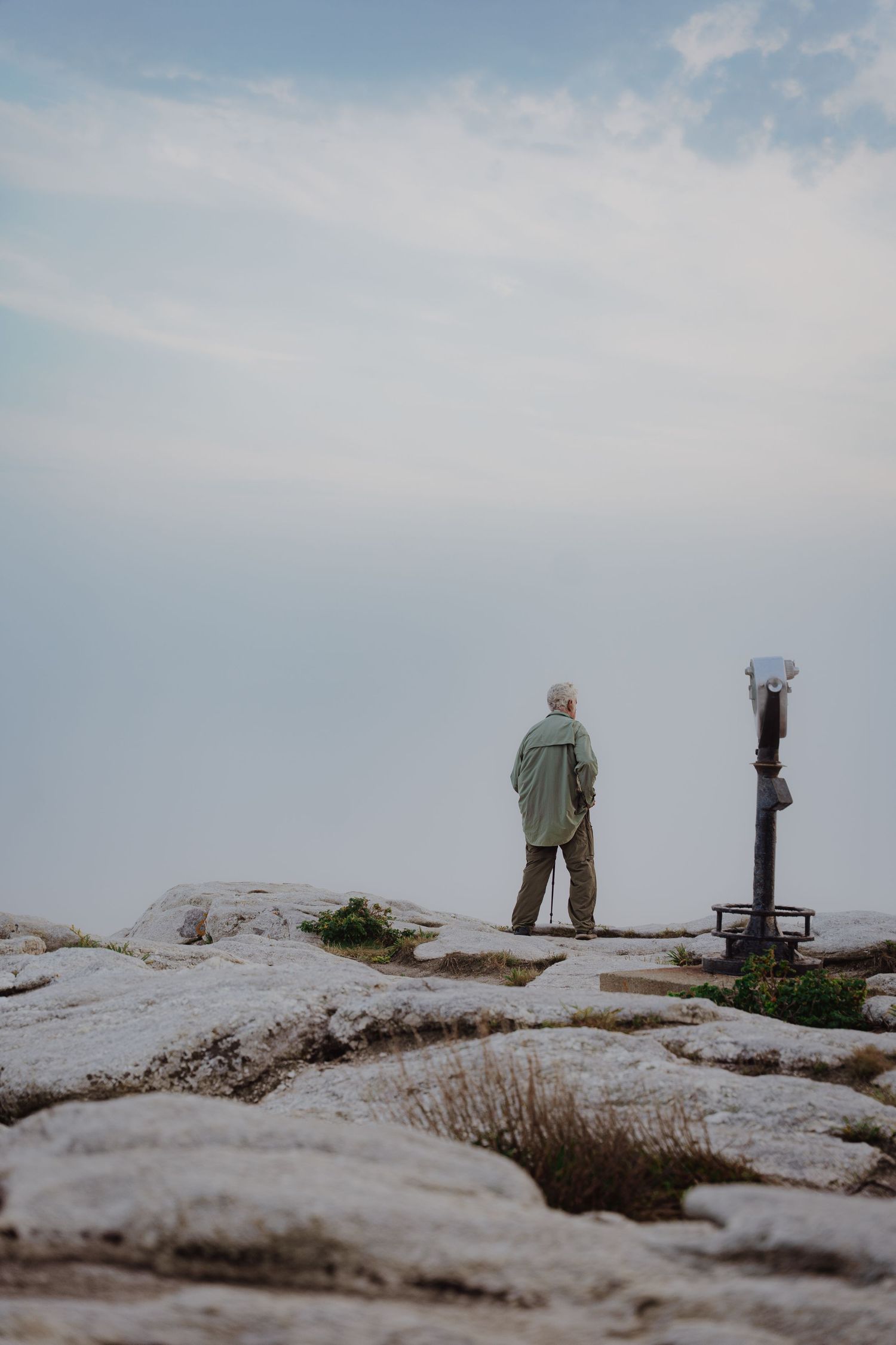 man posing on rocks
