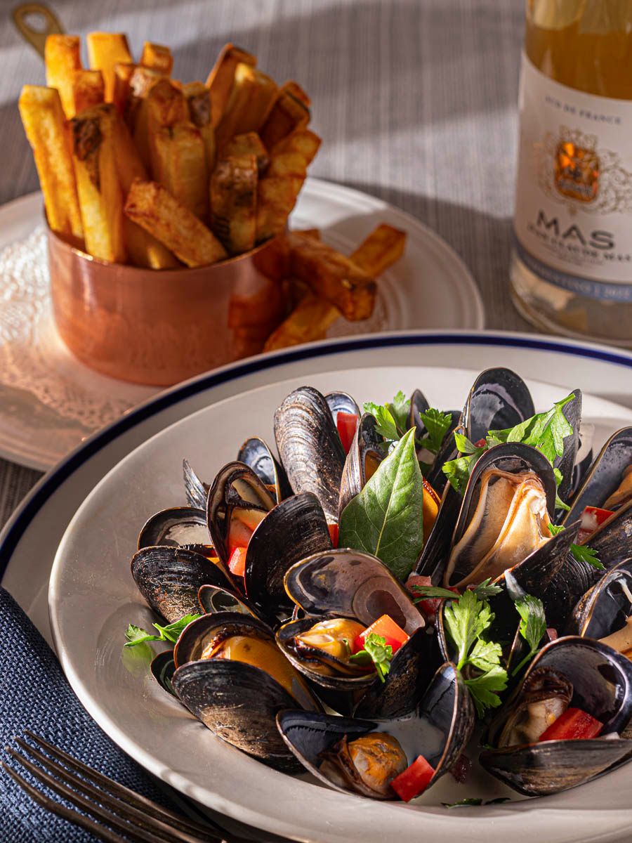 Classic mussels - moules frites in natural light photographed for lunch