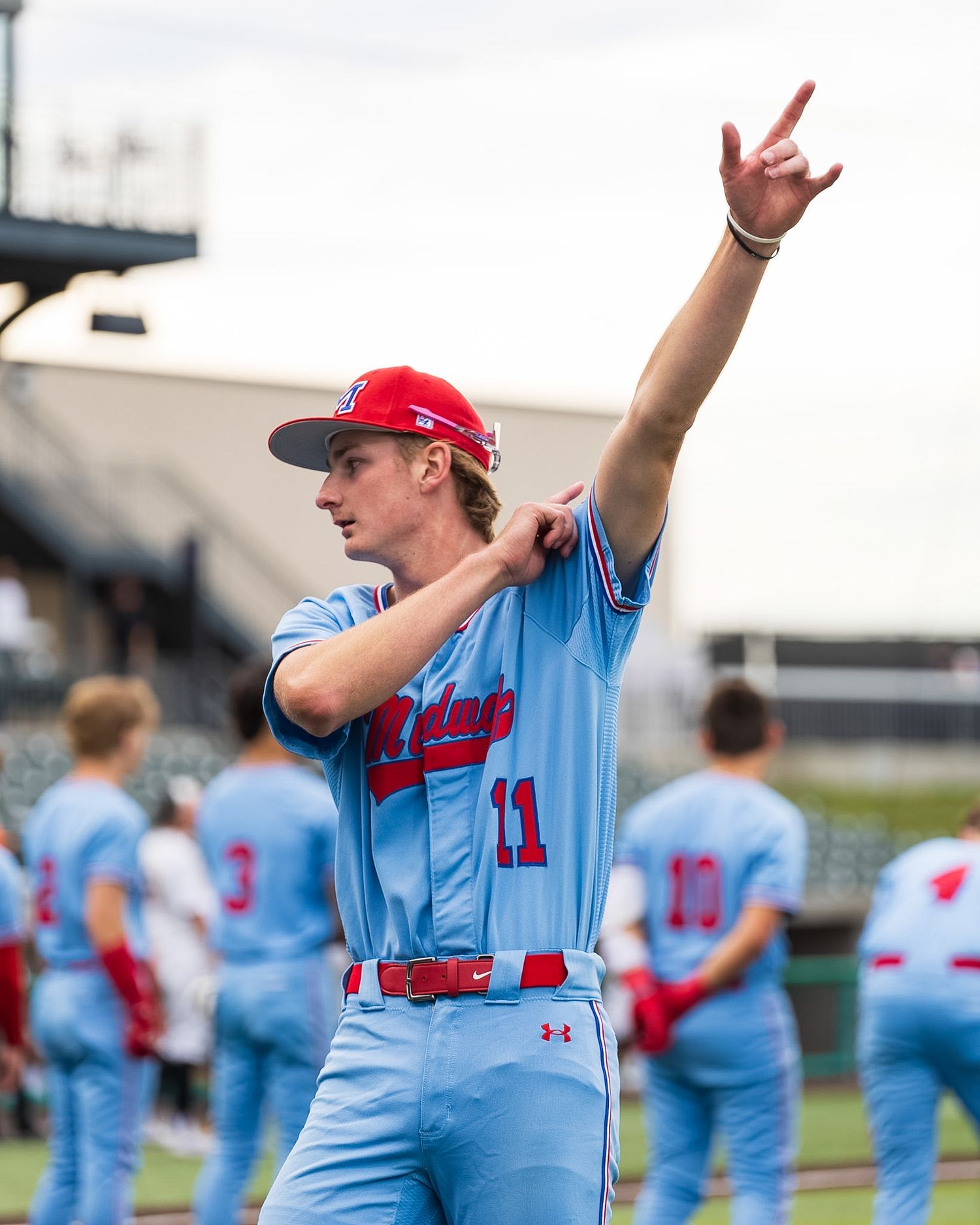 baseball player pointing to the sky in celebration