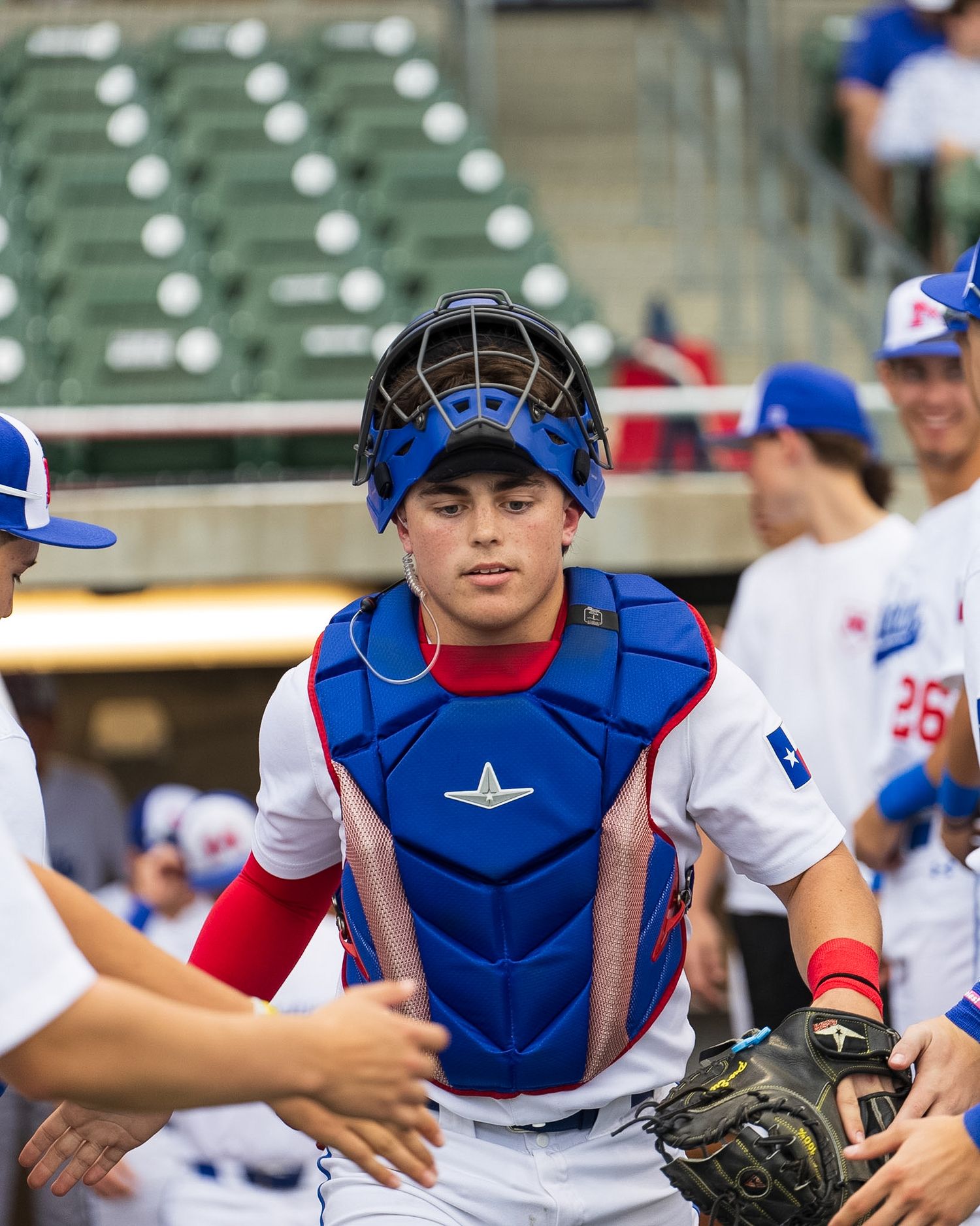 catcher coming out of the dugout