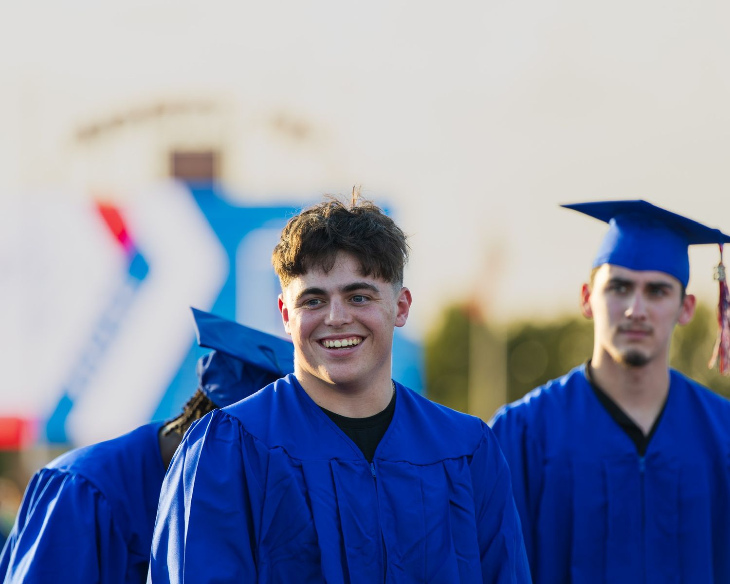 student smiling at graduation