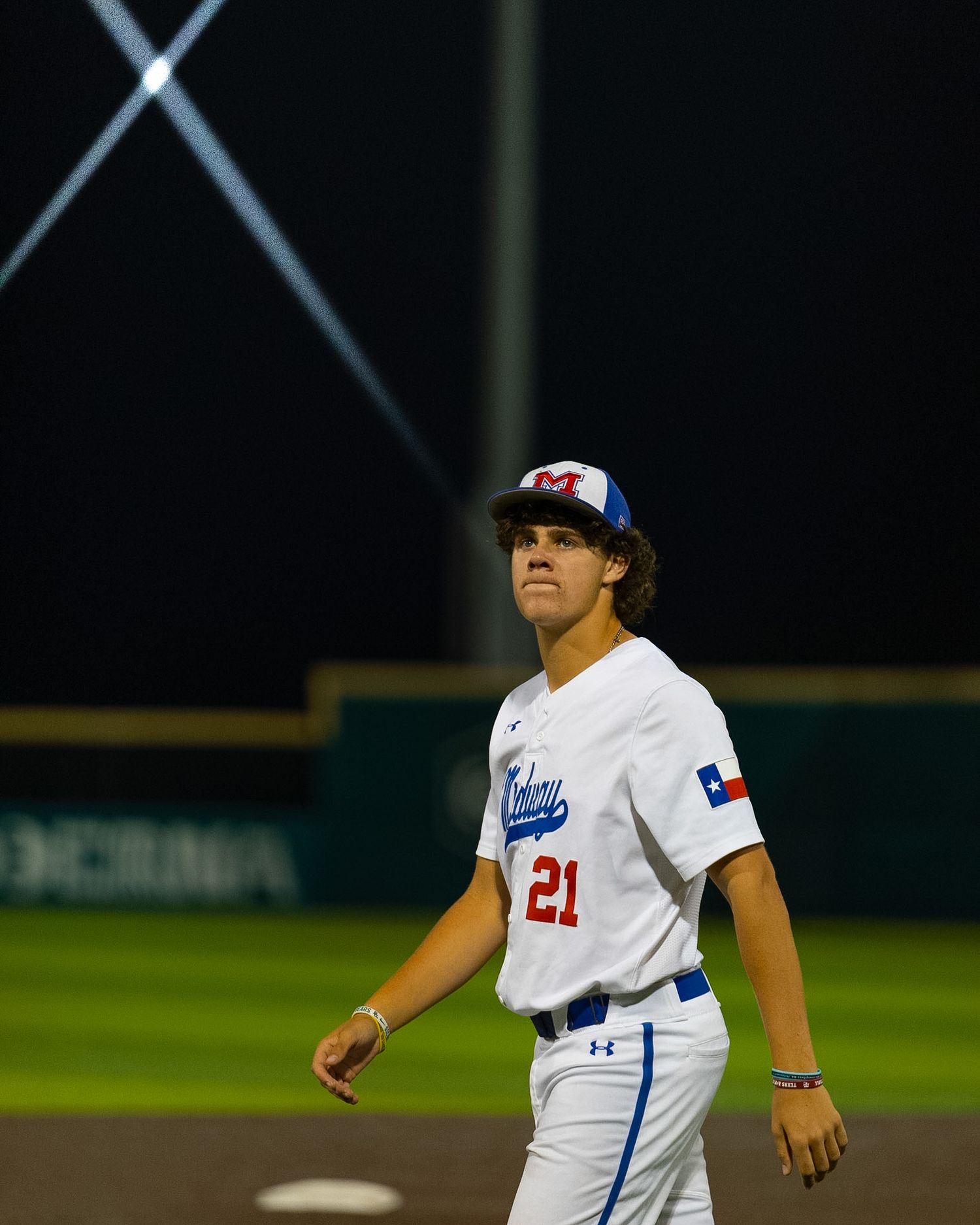 baseball player walking off the field