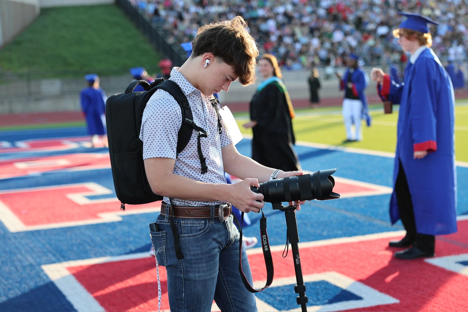 photographer standing taking a picture