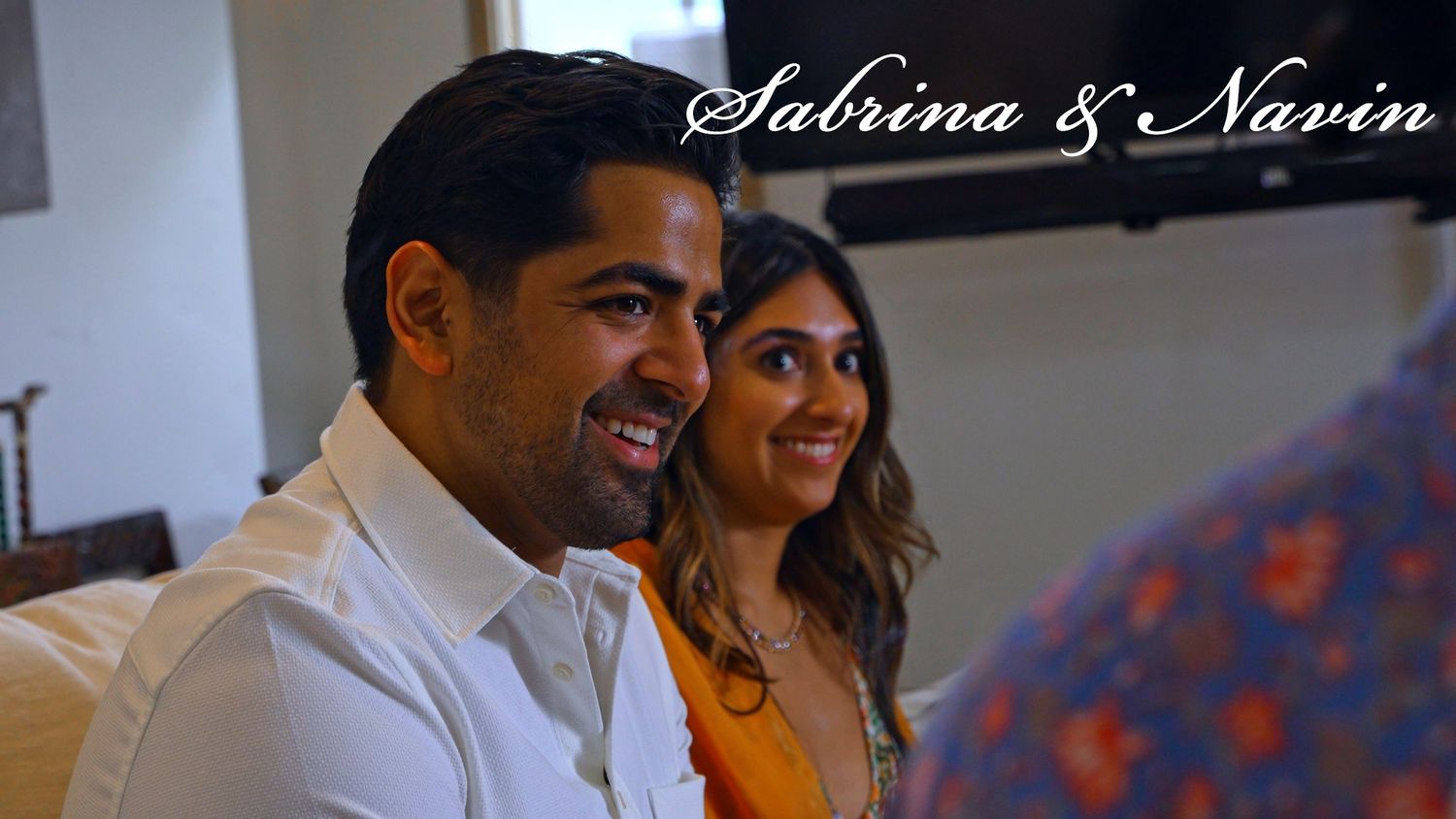 A candid moment captured of a couple at their wedding celebration.