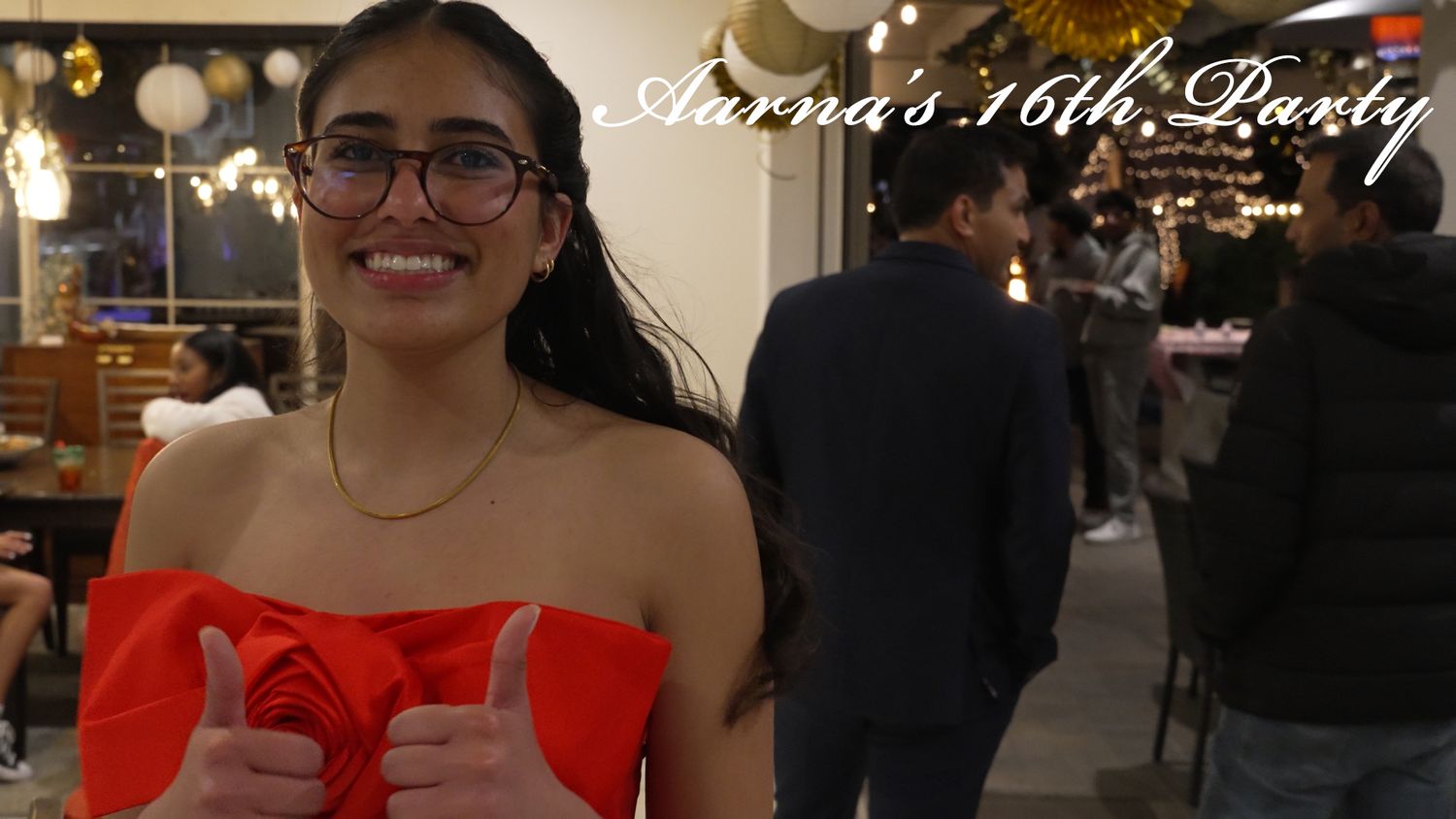 A celebration featuring someone in a red strapless dress at an elegant indoor venue.