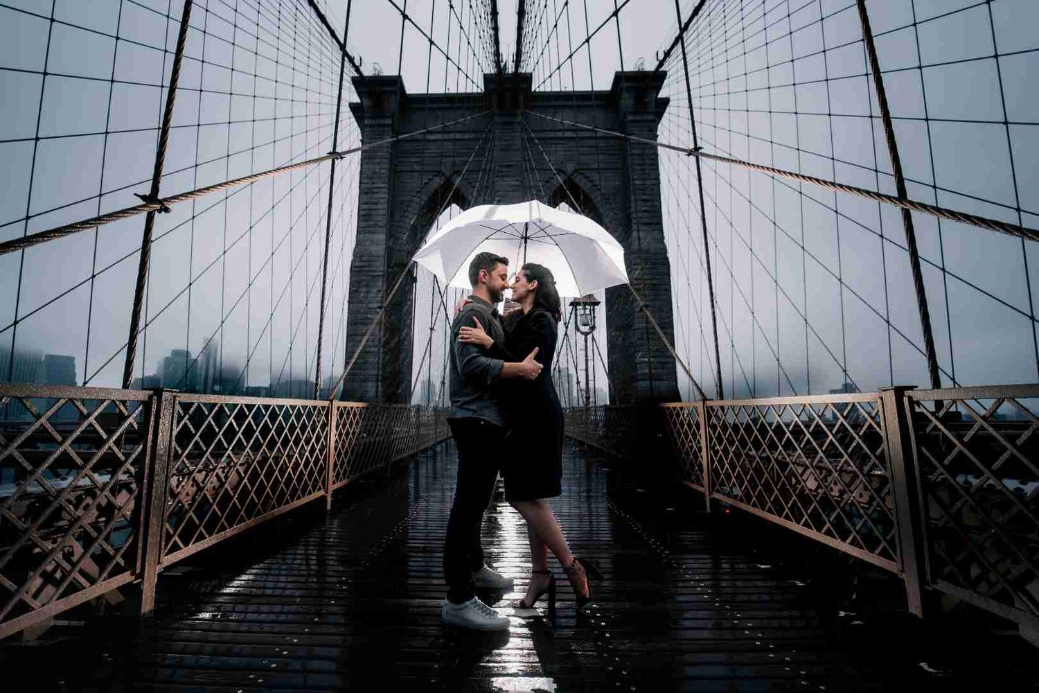 Memory Lane Studios black and white fine art wedding photography at Brooklyn Bridge New York featuring iconic walkway and architecture