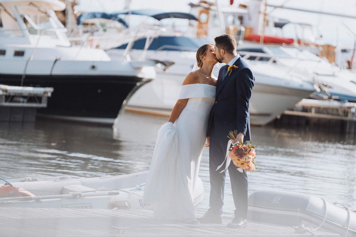 Memory Lane Studios editorial style wedding photography in New York featuring romantic couple portrait on waterfront dock at golden hour