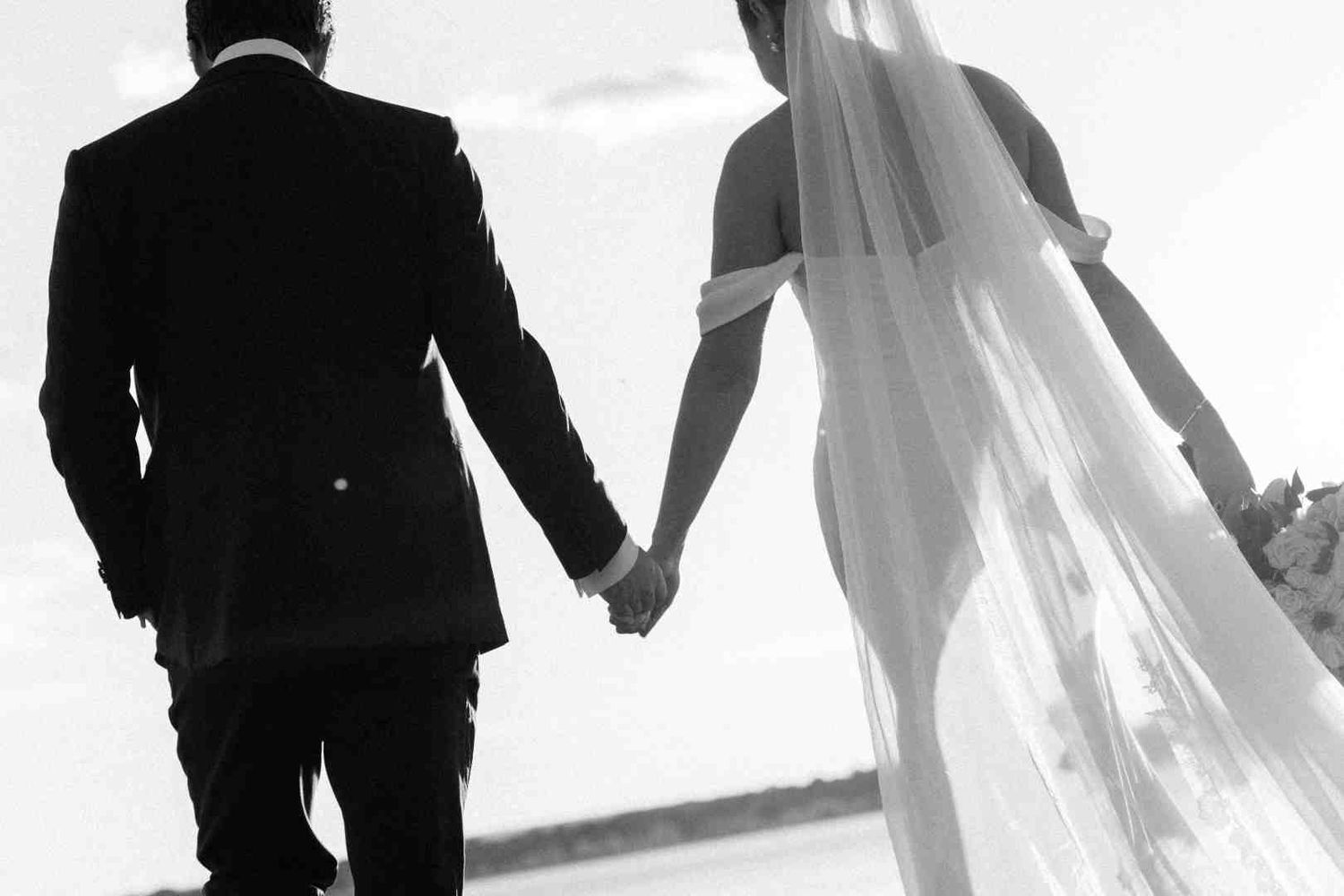 Memory Lane Studios artistic black and white wedding party silhouette at Connecticut Country Club with bride dress flowing in breeze