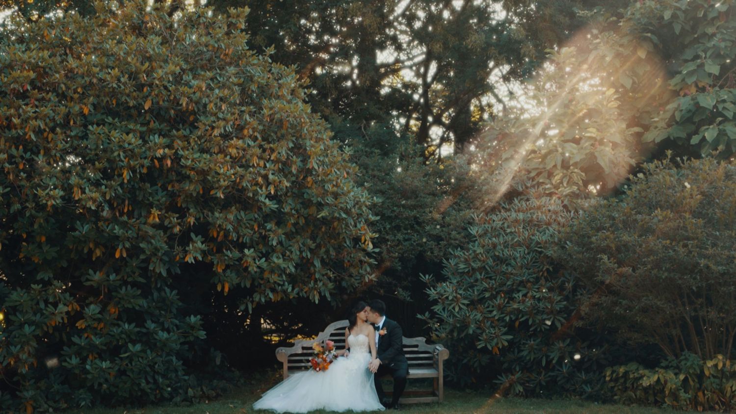Memory Lane Studios romantic outdoor wedding ceremony setup in Boston with rustic wooden chairs and floral arrangements by Tharun Palla