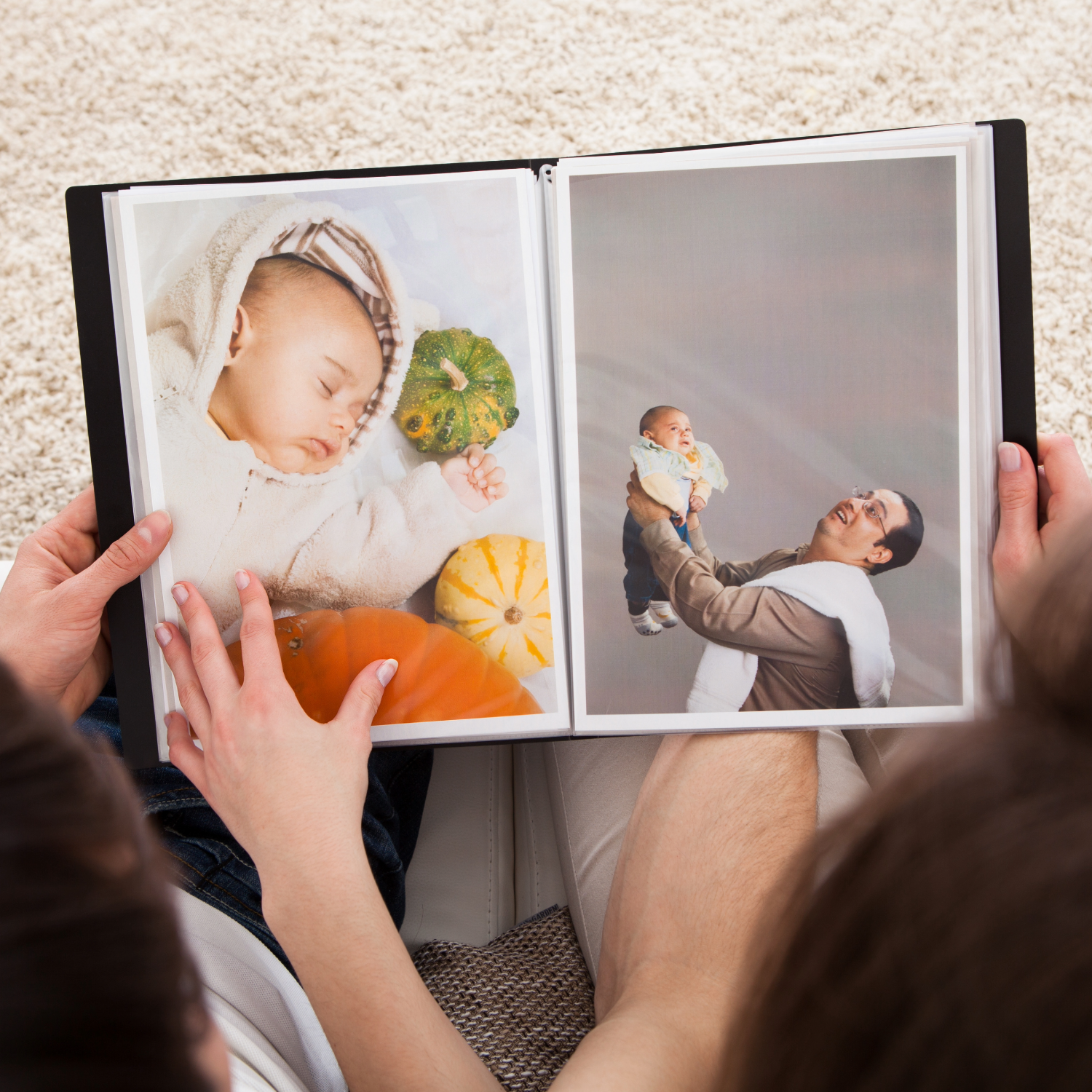 Someone flips through a photo album displaying images arranged in sequence on printed pages.