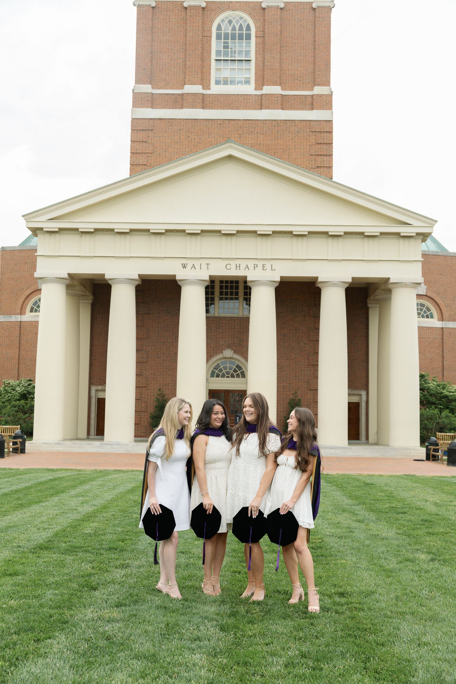 Group photo series showing graduates in white dresses posing in front of a brick chapel building.
