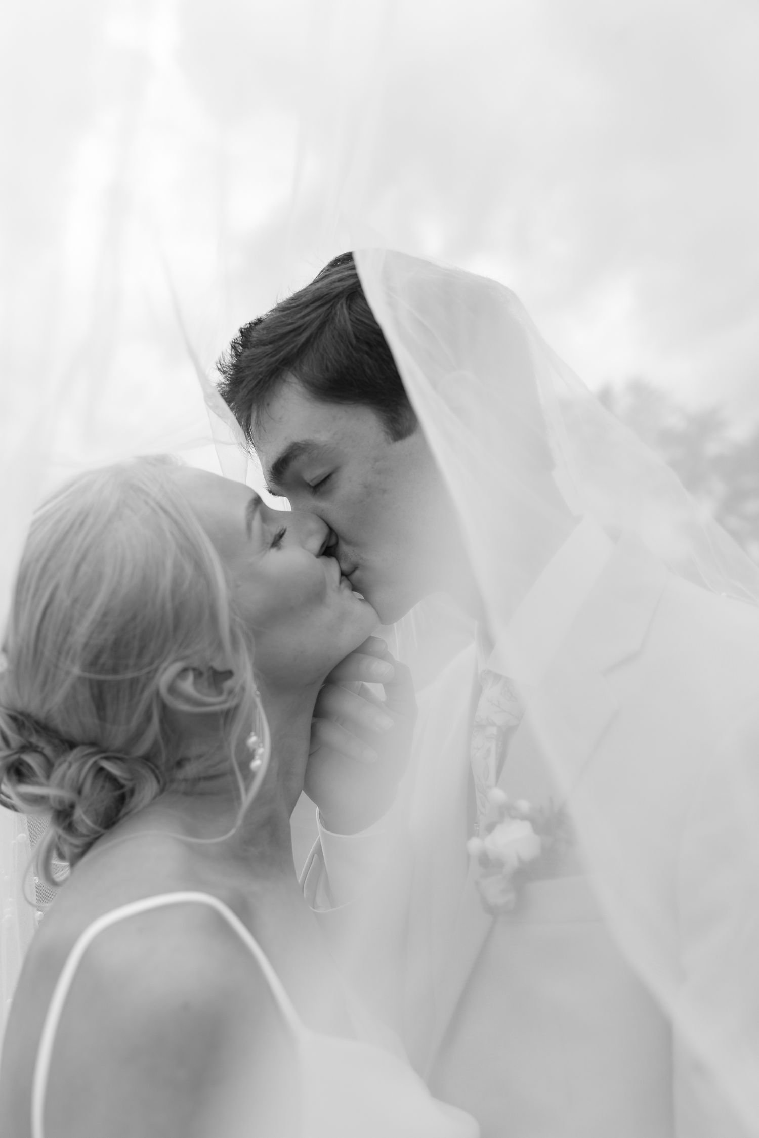 Romantic black and white portrait series showing tender moments between a couple.
