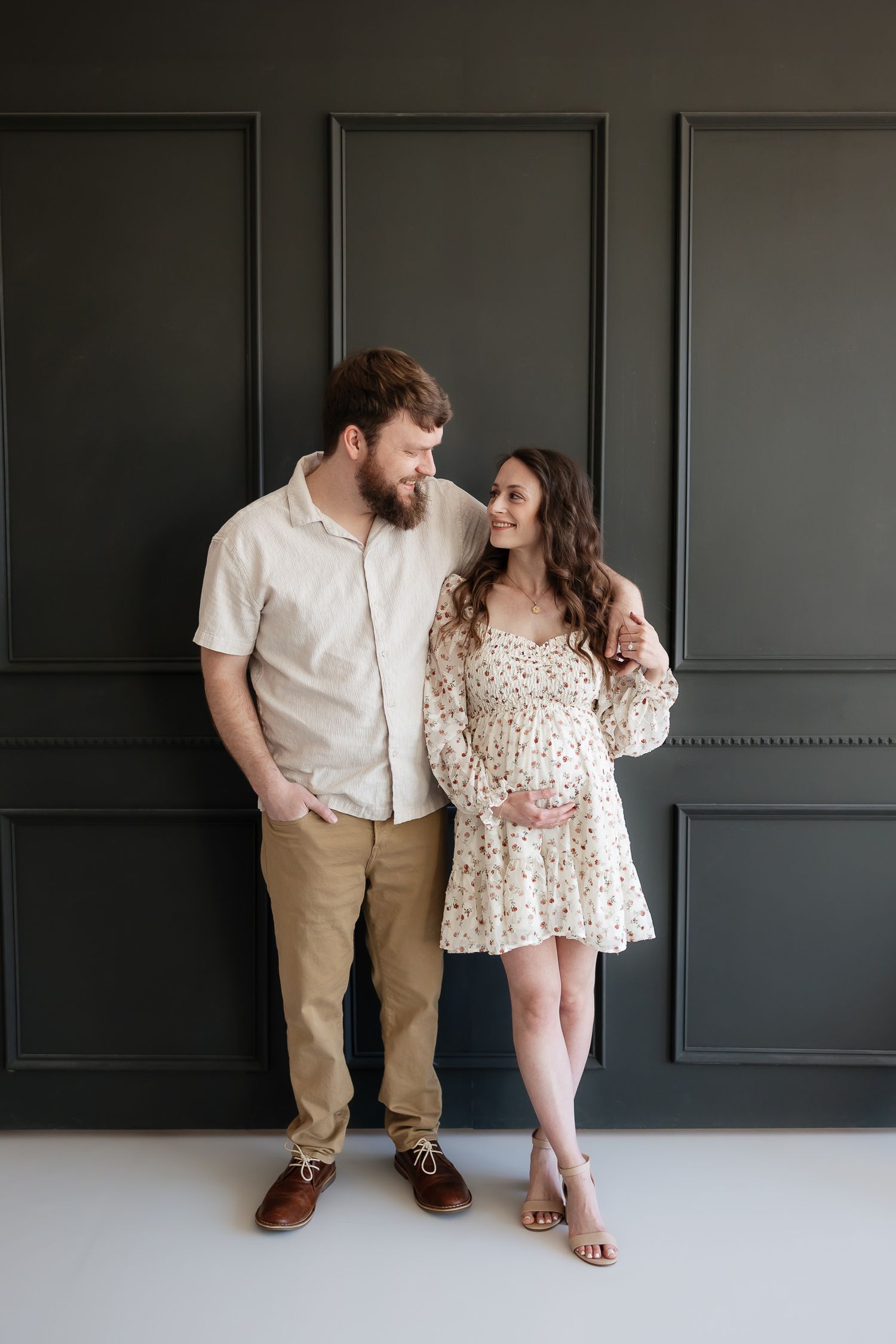 photographer overland park ks takes studio maternity photos at the studio reverie of mom and dad expecting baby