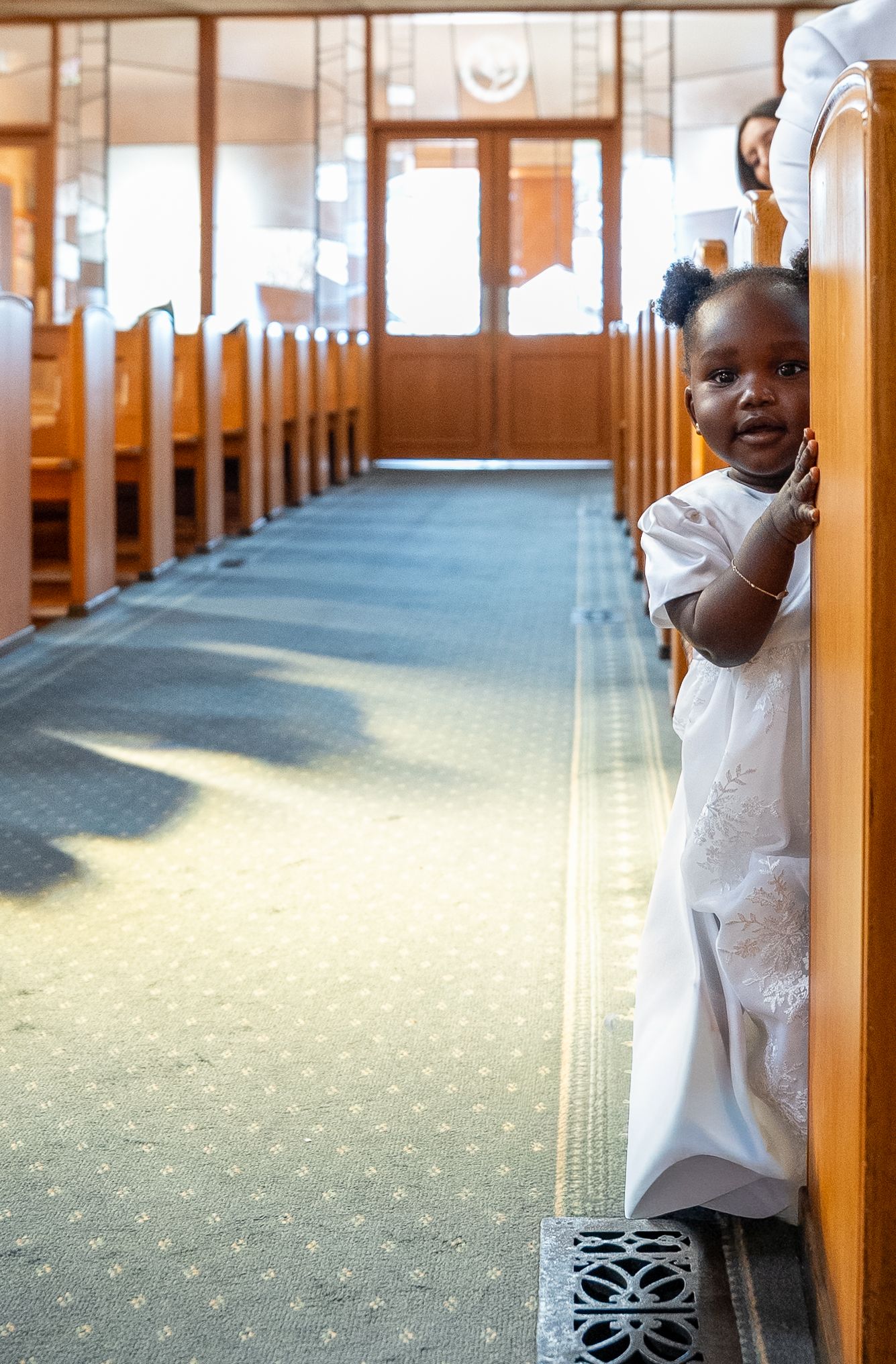 Child during a baptism ceremony in Melbourne