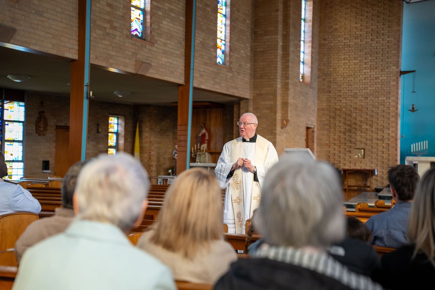 Priest performing a baptism ceremony in Melbourne
