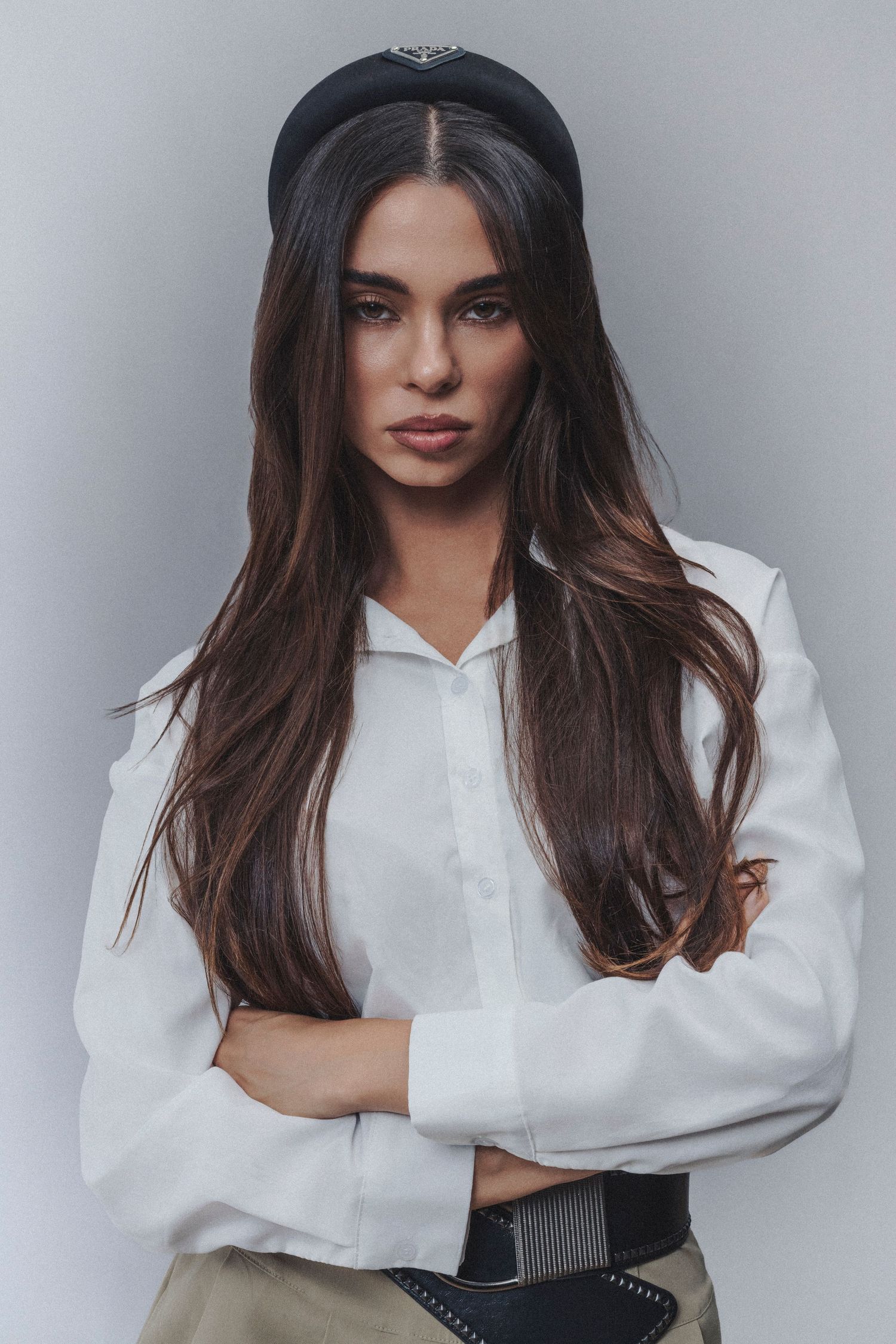Preppy-style fashion portrait photographed in a bright, polished setting with classic preppy clothing and timeless styling.
