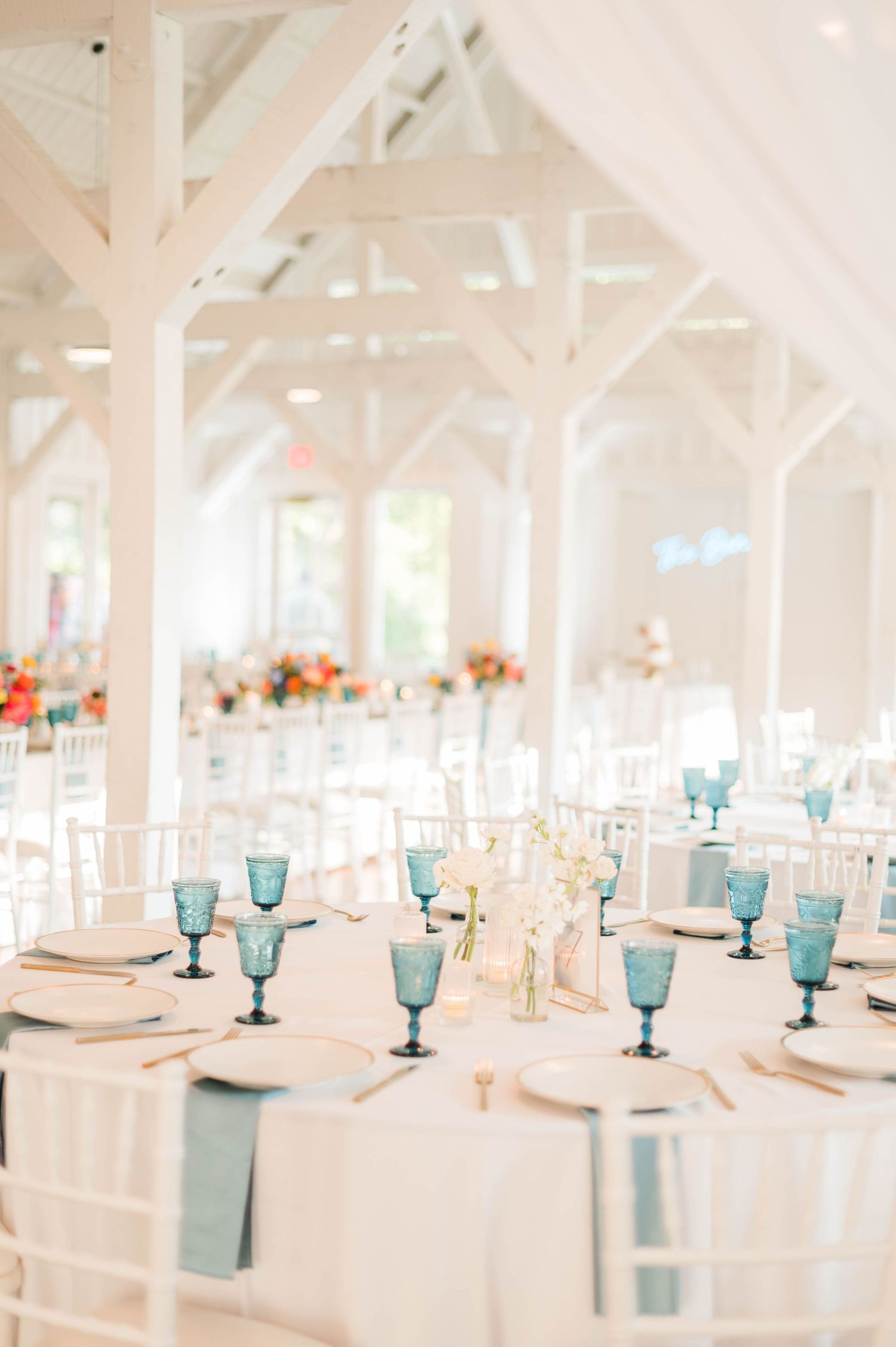 Blue goblets on white table clothes at Spain Ranch, Tulsa, OK.