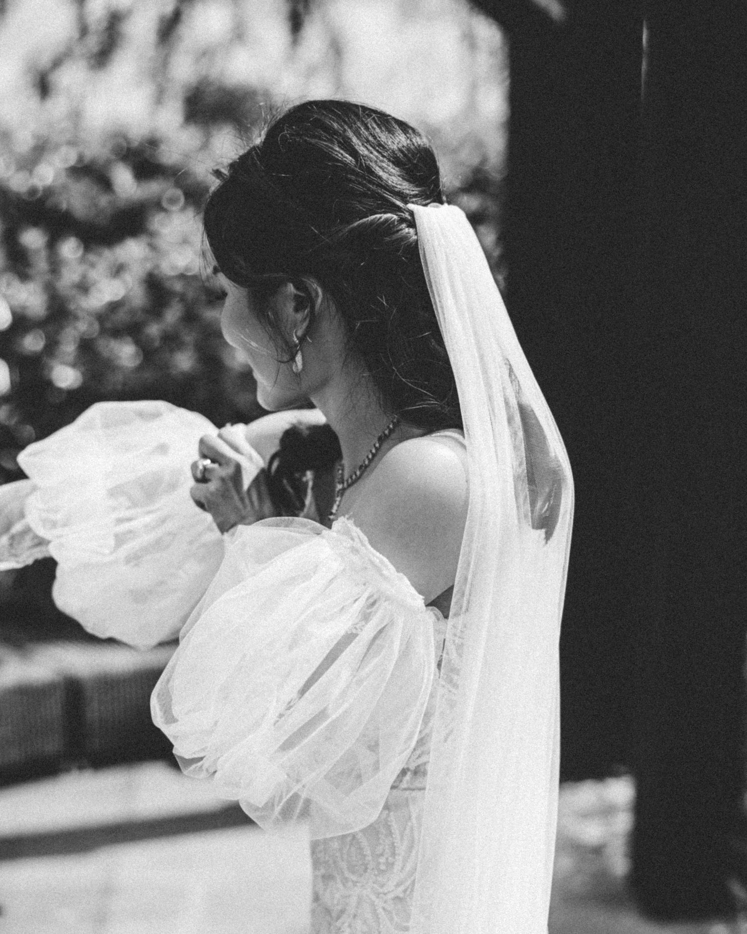 Black and white close-up bridal portraits showing detailed lace and veil.