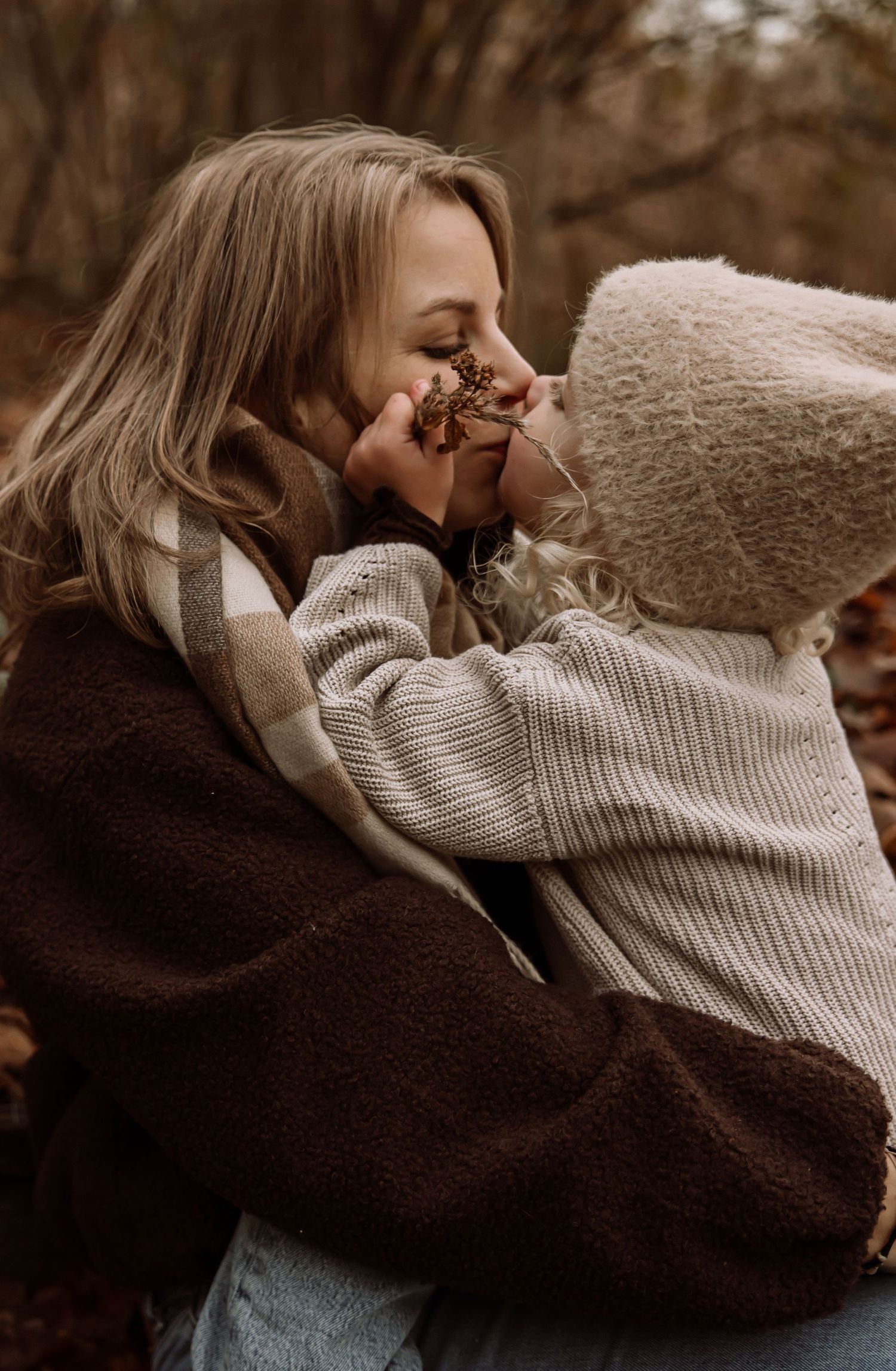 Cozy autumn portrait with knit sweaters and warm embrace.