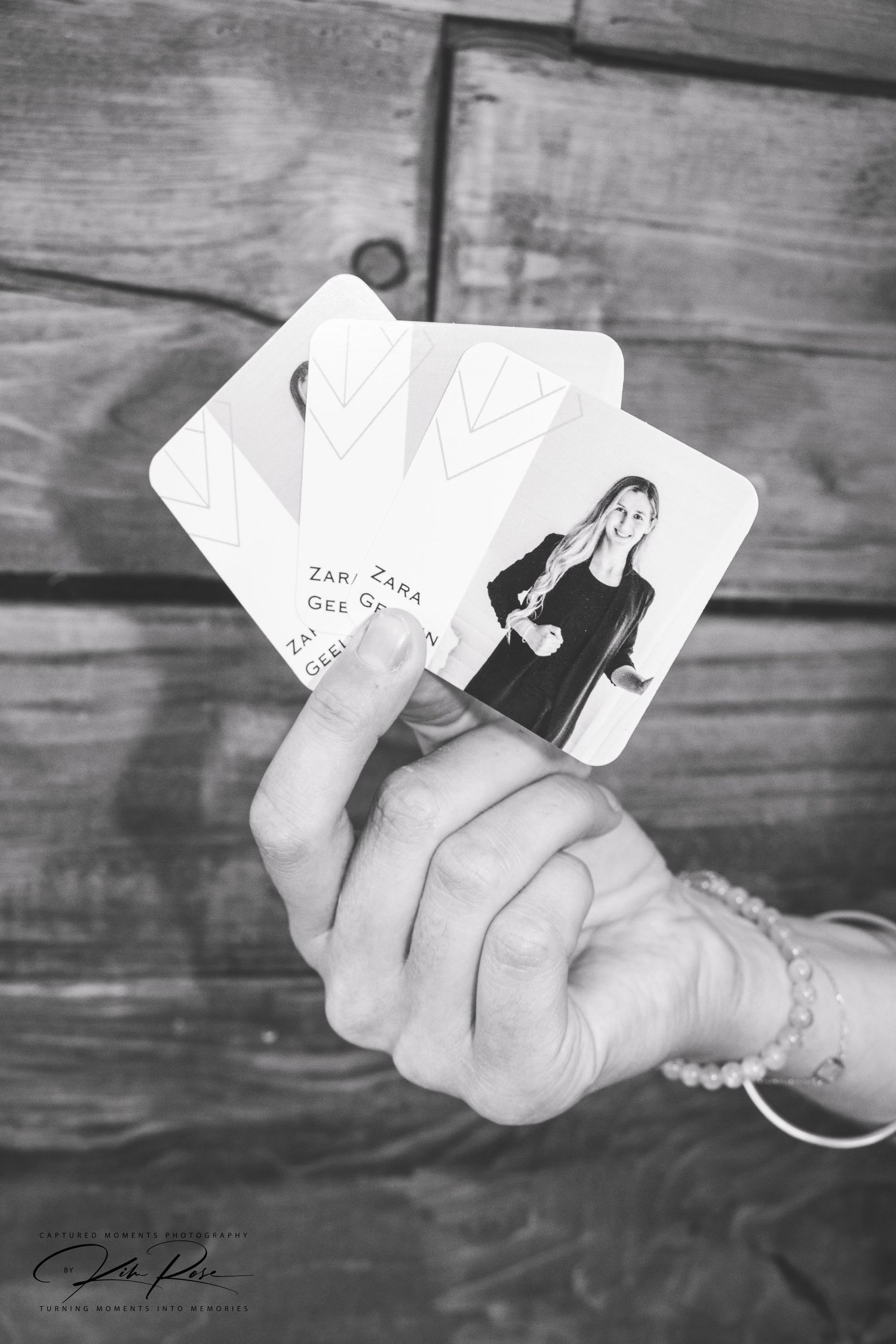 Close-up of hands exchanging business cards at a Fort St John networking event.