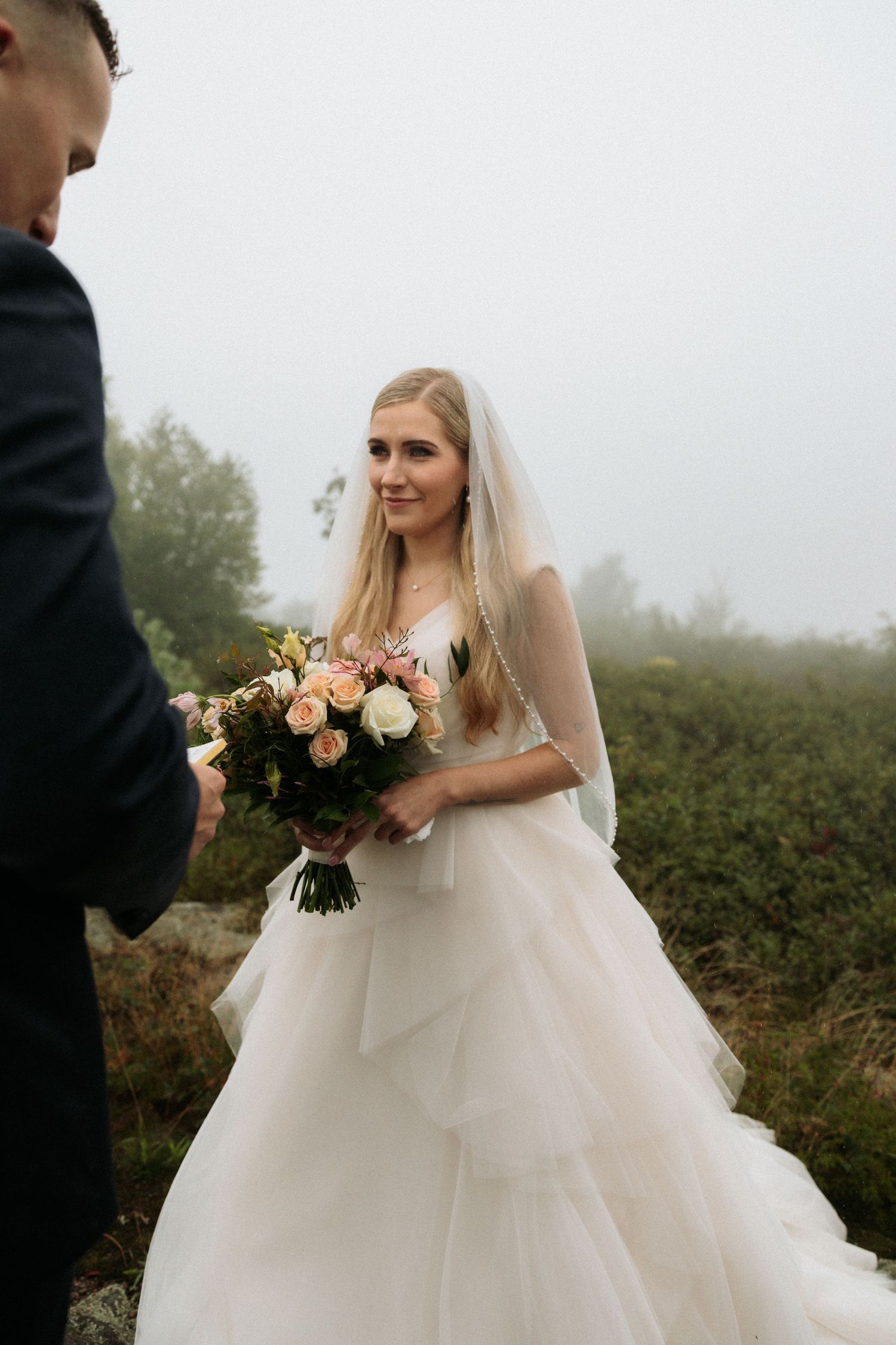 bride looking longingly at groom