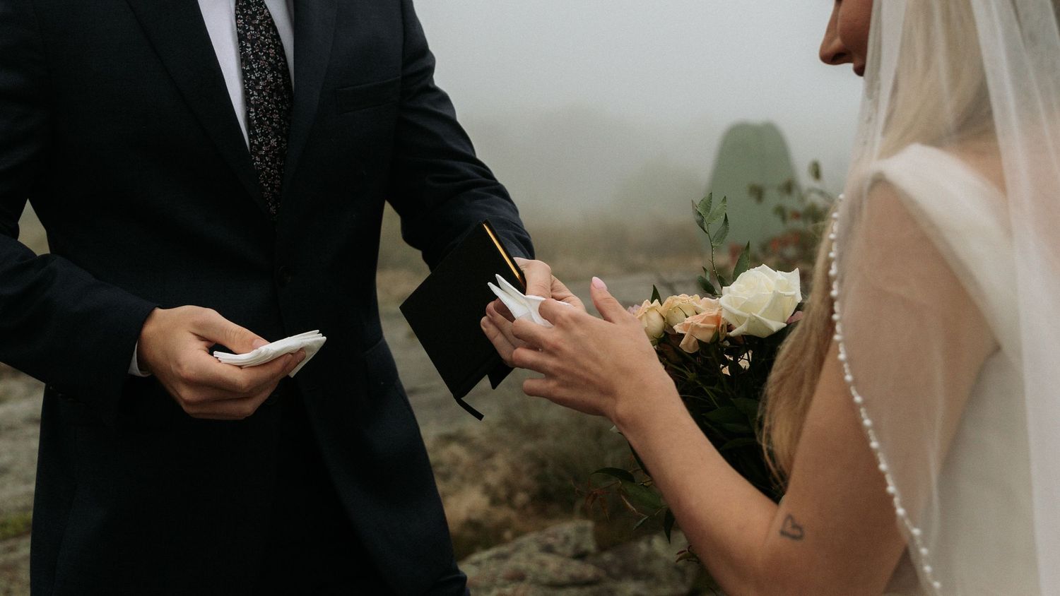 groom handing bride tissue