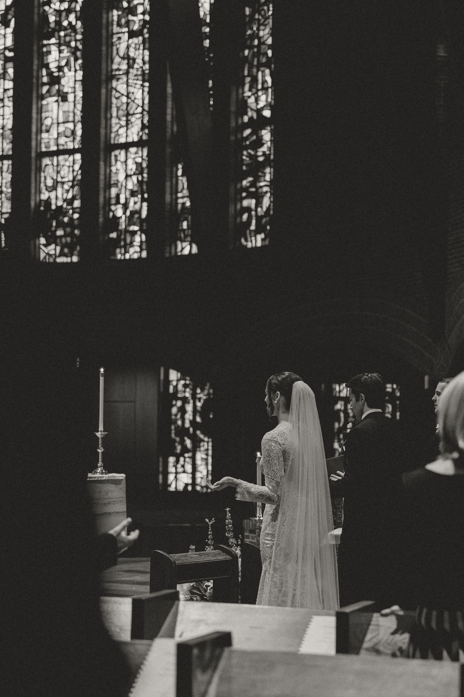 A series of black and white images showing a ghostly figure in a veil moving through a dimly lit church interior.