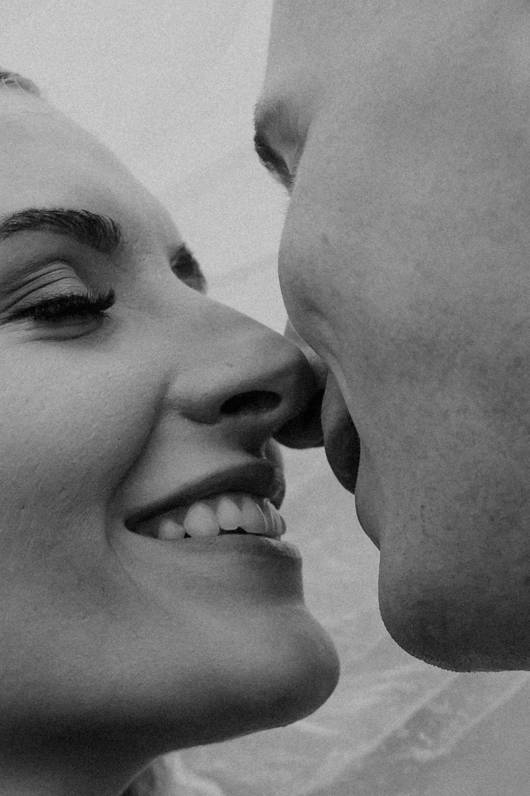 Romantic black and white photo series showing close-up kisses between a couple.