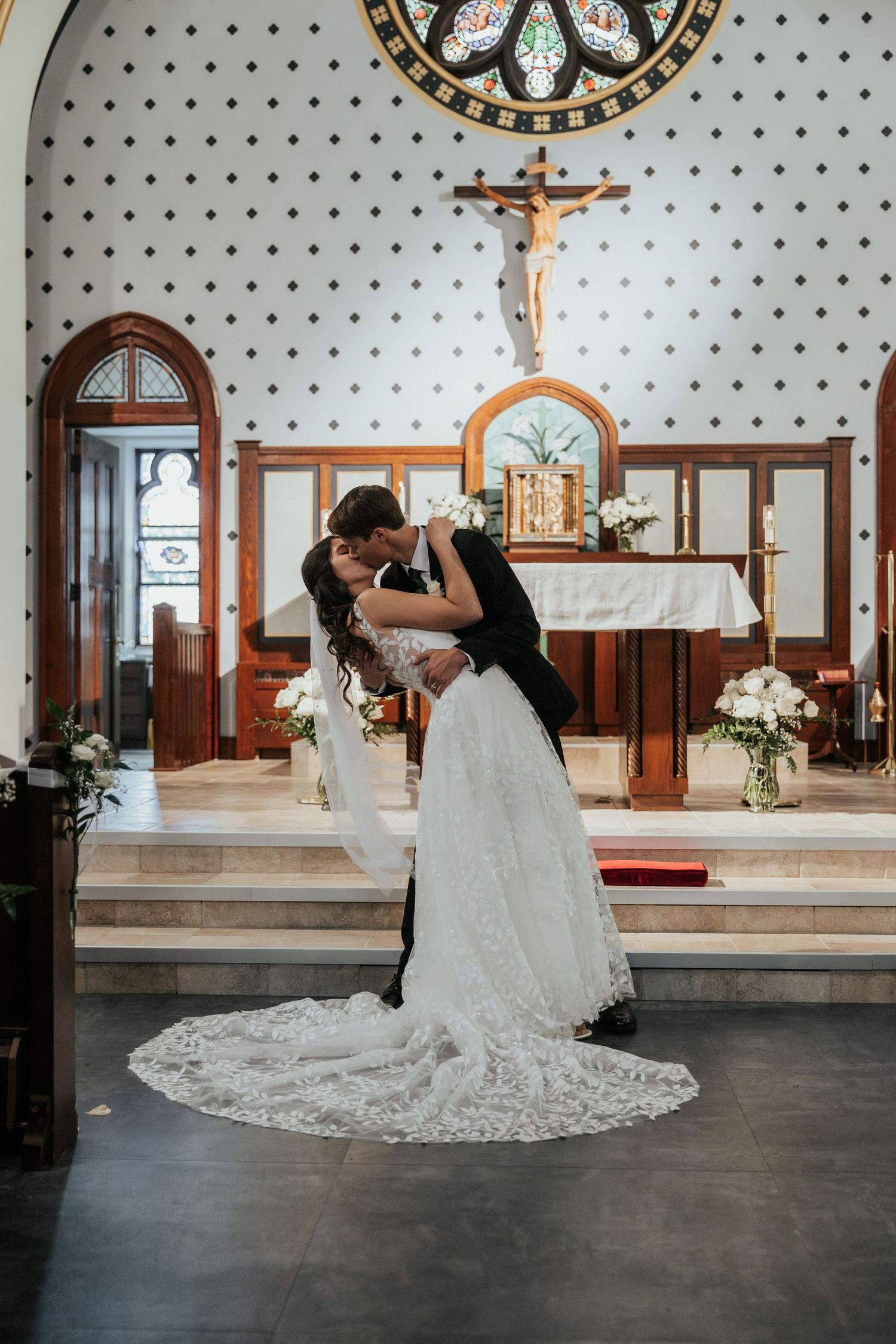 Catholic wedding big kiss